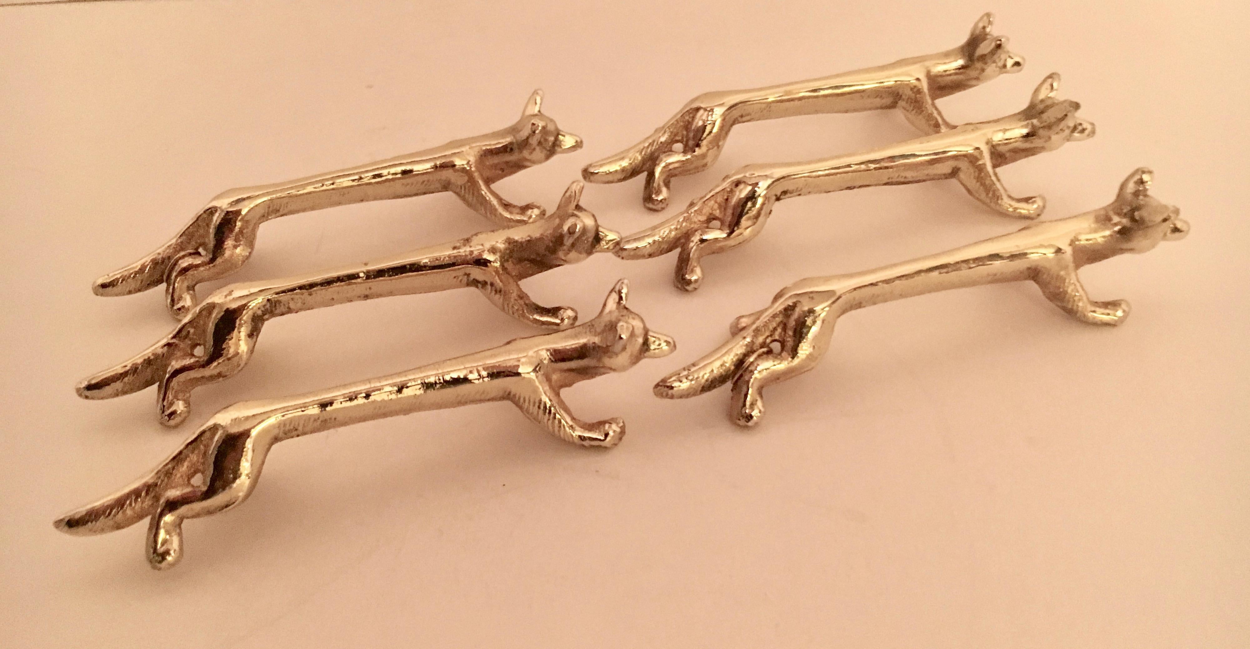 Set of six brass fox knife rests, freshly plated in shiny and tarnish resistant brass. For the most relaxed to elegant of tables. Rest assured with this lovely set!