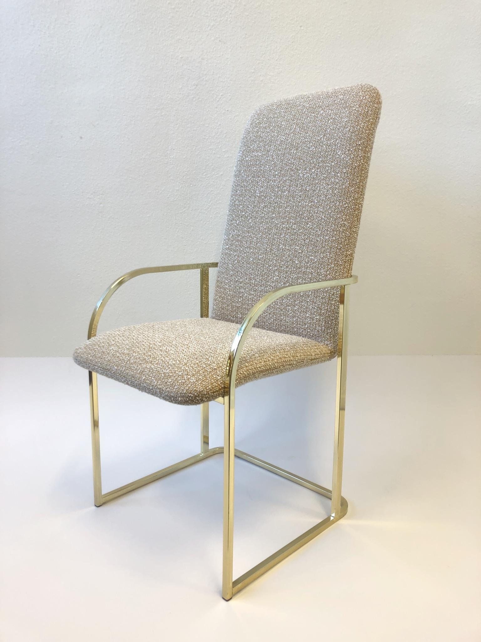 A glamorous set of six polish brass high back dining chairs designed by Design Institute of America. Newly recovered in a beautiful nubby fabric (see detail photos). The brass shows minor wear. 

Dimension: 44” high, 25” arm, 19.5” seat, 27” deep,