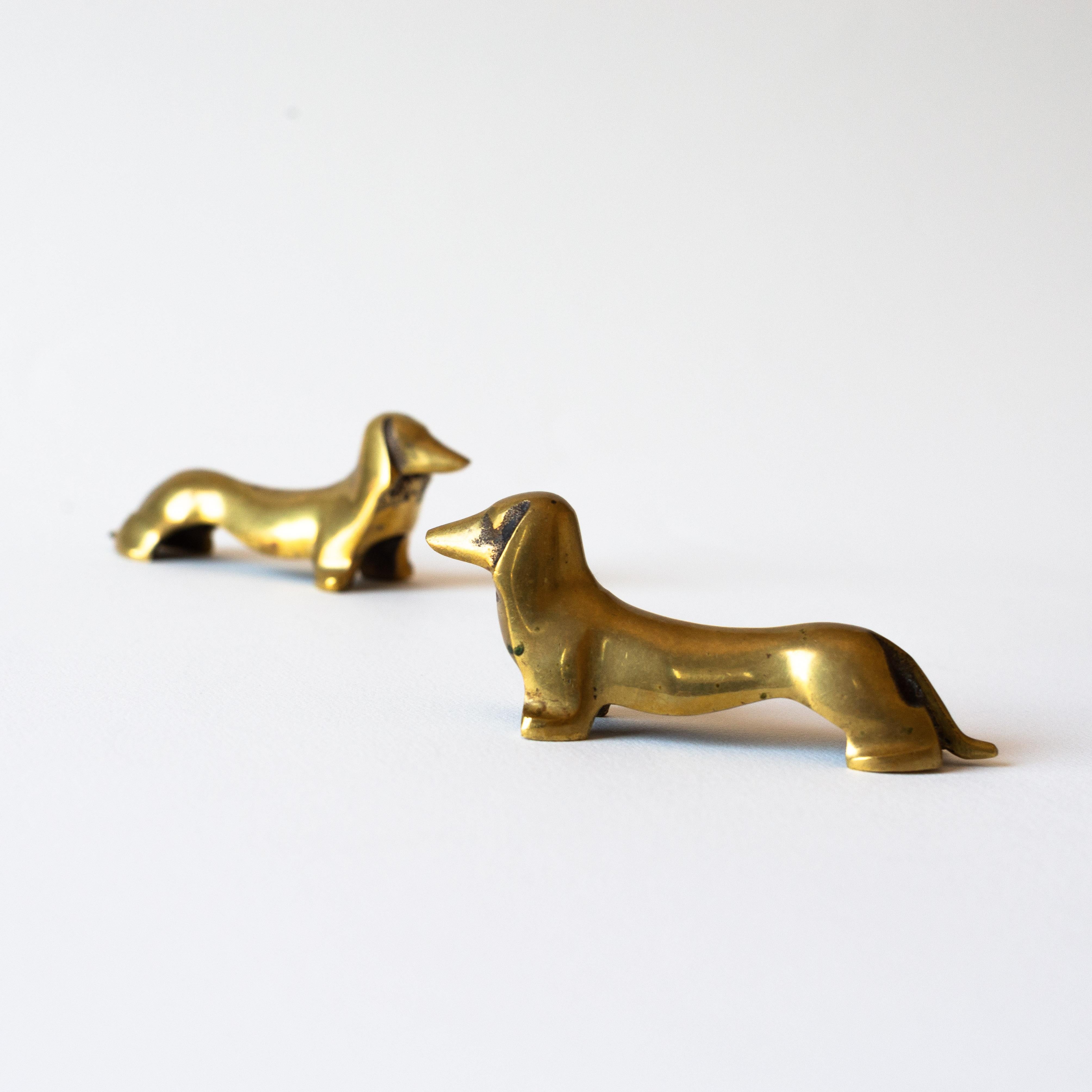 Set of Six Brass Knife Rests, Dachshund Dog, France Mid-Century Modern

Brass knife rests in the shape of Dachshund dogs, crafted in France in the 1970s. 

Charming vintage pieces with a well-aged appearance that adds to their allure. 

The brass