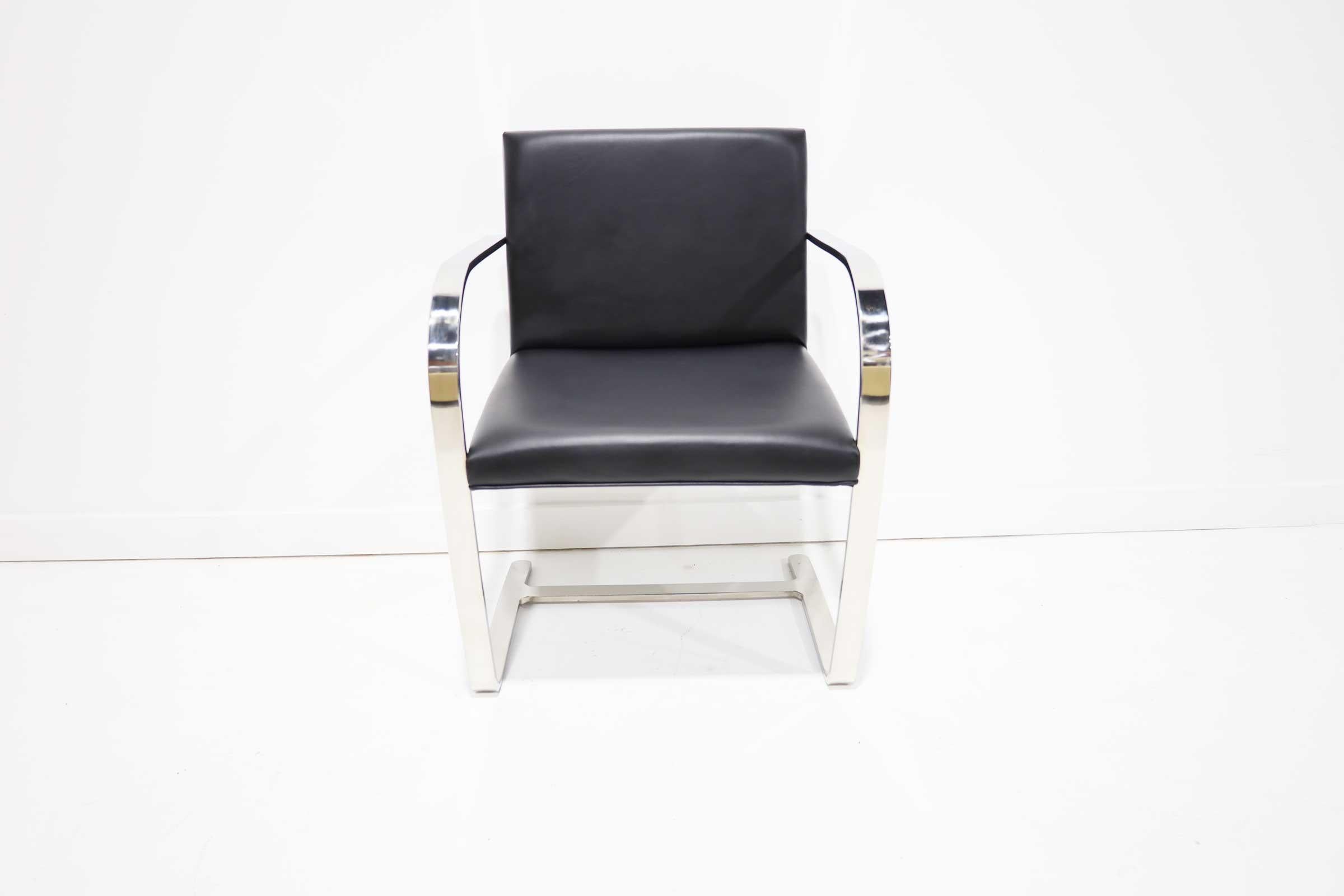 The Brno chairs was designed by Ludwig Mies van der Rohe for Knoll. It is an iconic design that works well in many environments. This set has a polished stainless steel frame and is upholstered in a faux leather. Chairs are very clean and