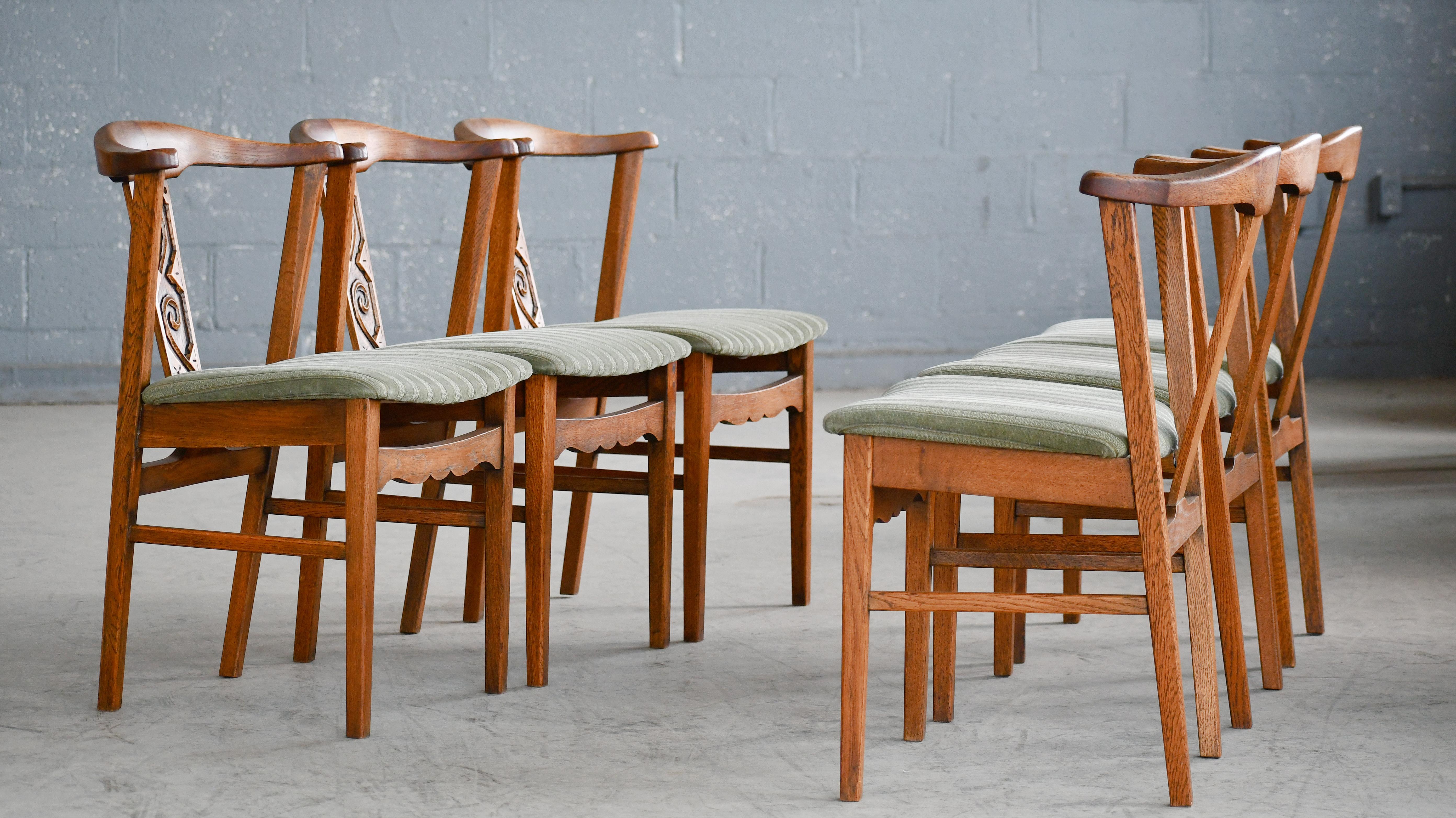 Set of 6 Danish oak dining chairs attributed to Henning Kjærnulf made in the 1960's. and carved in a brutalist design in solid oak.  Very typical of Kjærnulf.'s designs as he was known for combining the midcentury style with more brutalist rustic