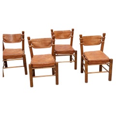 Set of six brutalist leather dining chairs