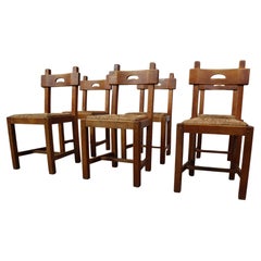 Set of six brutalist, rustic dining chairs in Oak and Rush, Spain 1960's!