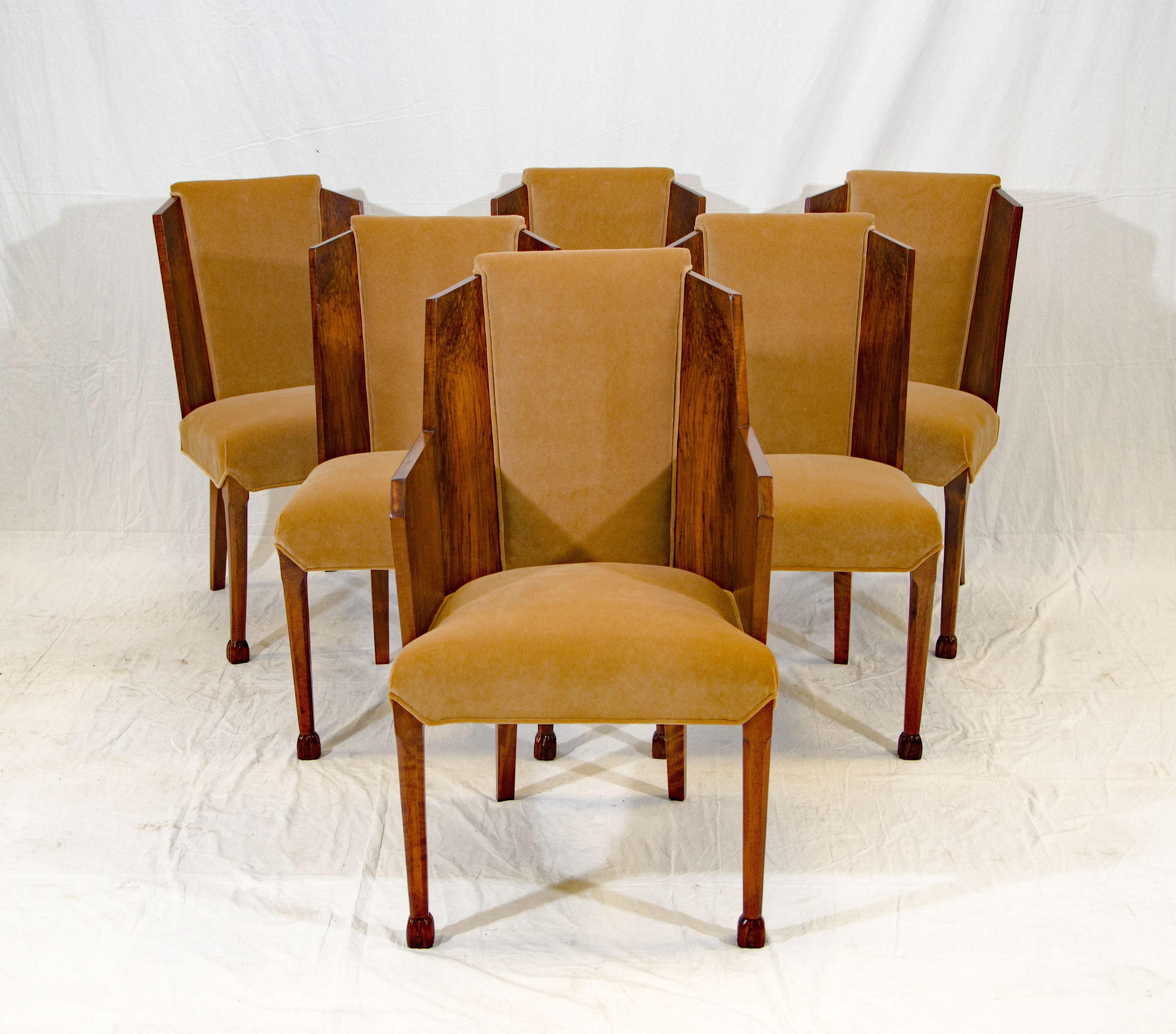 A gorgeous set of six French Art Deco dining chairs in burl walnut and light brown cotton velvet upholstery. These chairs would make a statement in a formal Art Deco dining room but would look great with different styles of tables as well.
The