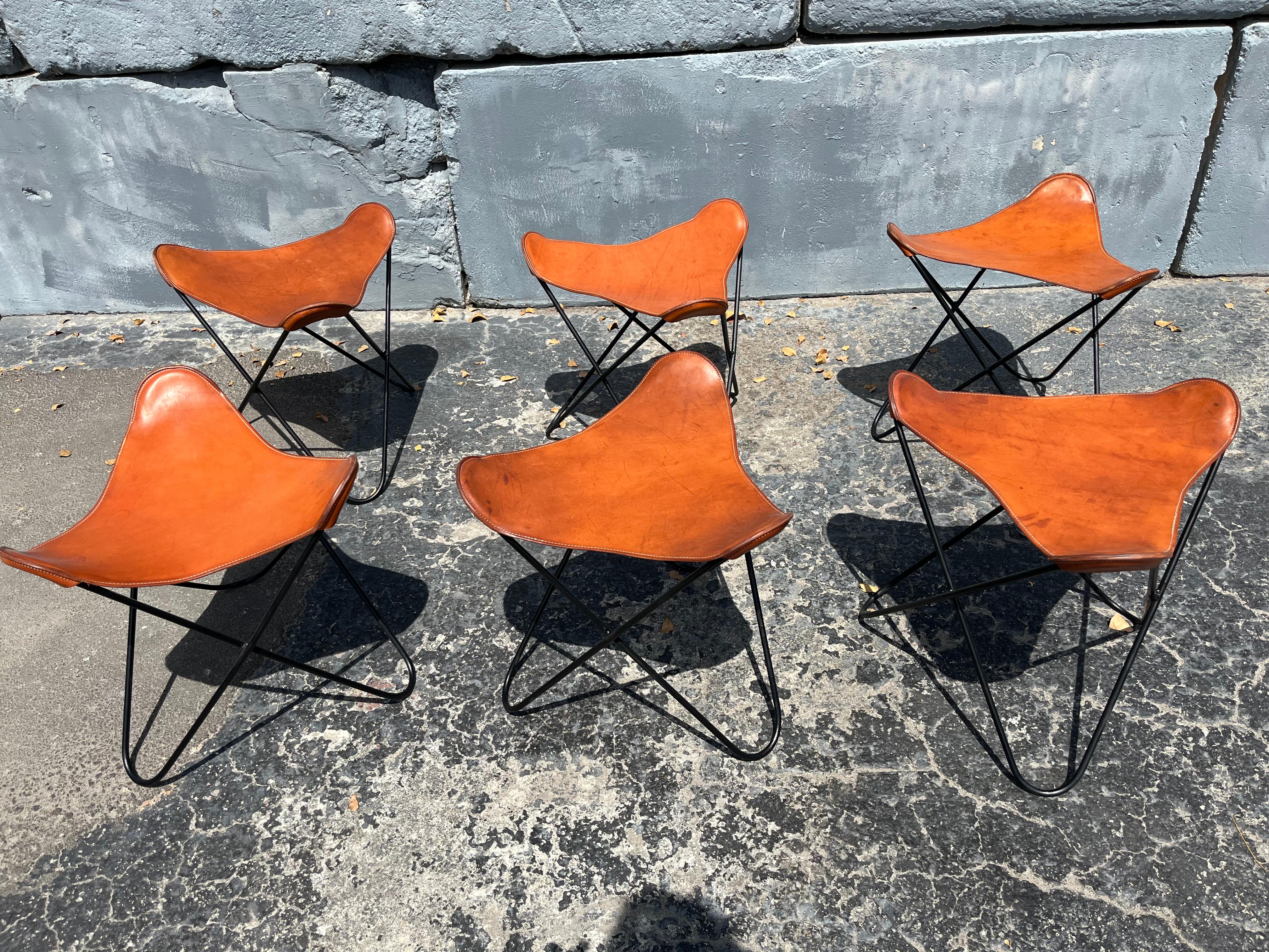 Set of Six Bonet, Kurchan & Ferrari-Hardoy  Butterfly Stools, Cognac Leather and black iron. Ready for a new home.