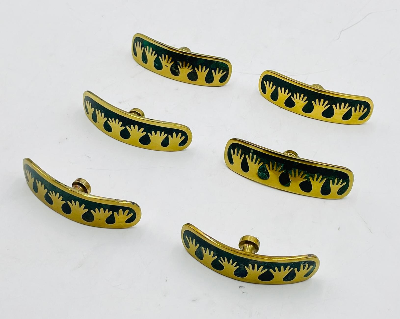Add a touch of Mexican flair to your cabinets with this stunning Set of Six Cabinet Pulls in Brass & Stone Inlay designed and manufactured in Taxco Mexico in the 1950's by Los Castillo. 
Each pull features a unique combination of brass and stone