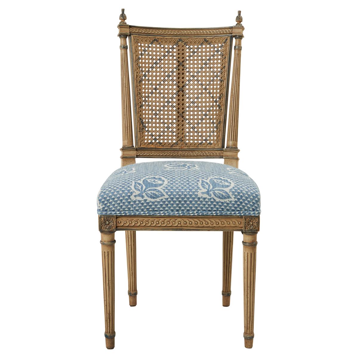 Discovered in France, these Directoire-style chairs are pretty, proper and truly chic around a dining table. Their neoclassical details and caned backs are accentuated by a lovely painted finish.
 
