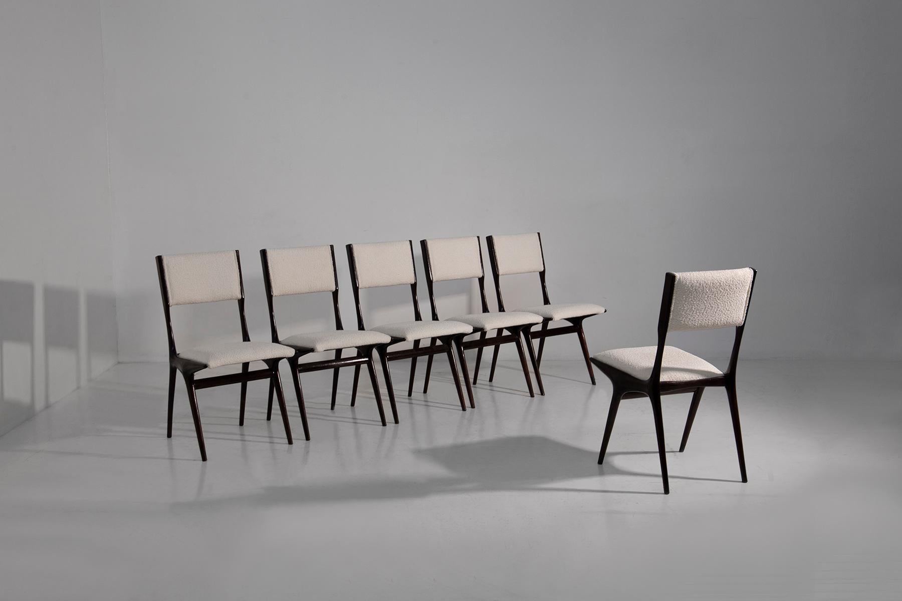 Immerse yourself in the timeless elegance of mid-century Italy with these exquisite Carlo De Carli chairs, each a masterpiece of design and craftsmanship straight from the 1950s. Imagine yourself sitting on the warmth of history: these chairs boast