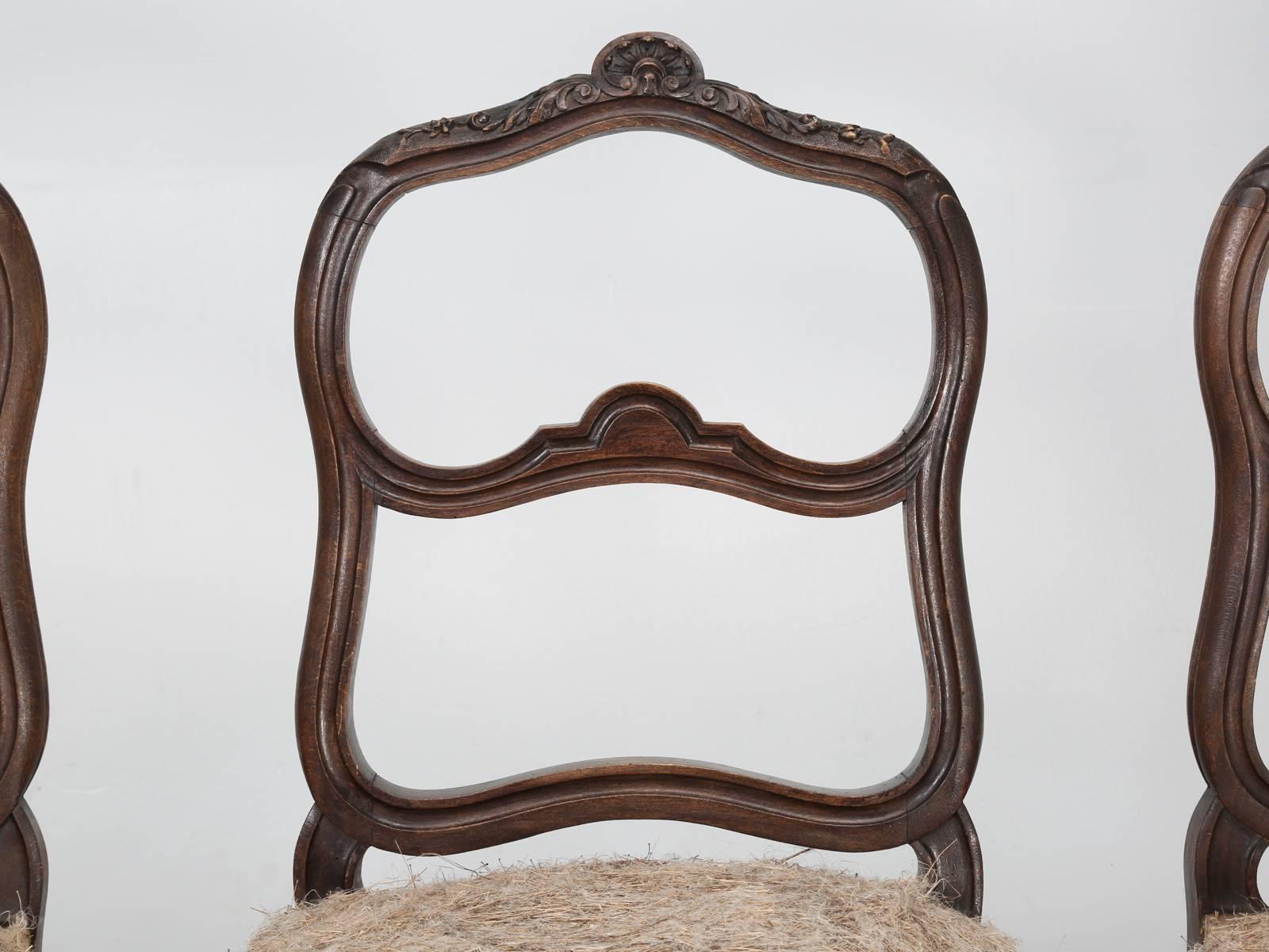Antique French set of (6) chairs, intricately carved in the late 1800s in as found condition. This set of (6) antique French living room or parlor chairs, still retain their original horsehair and shredded coco padding and are finished in a French