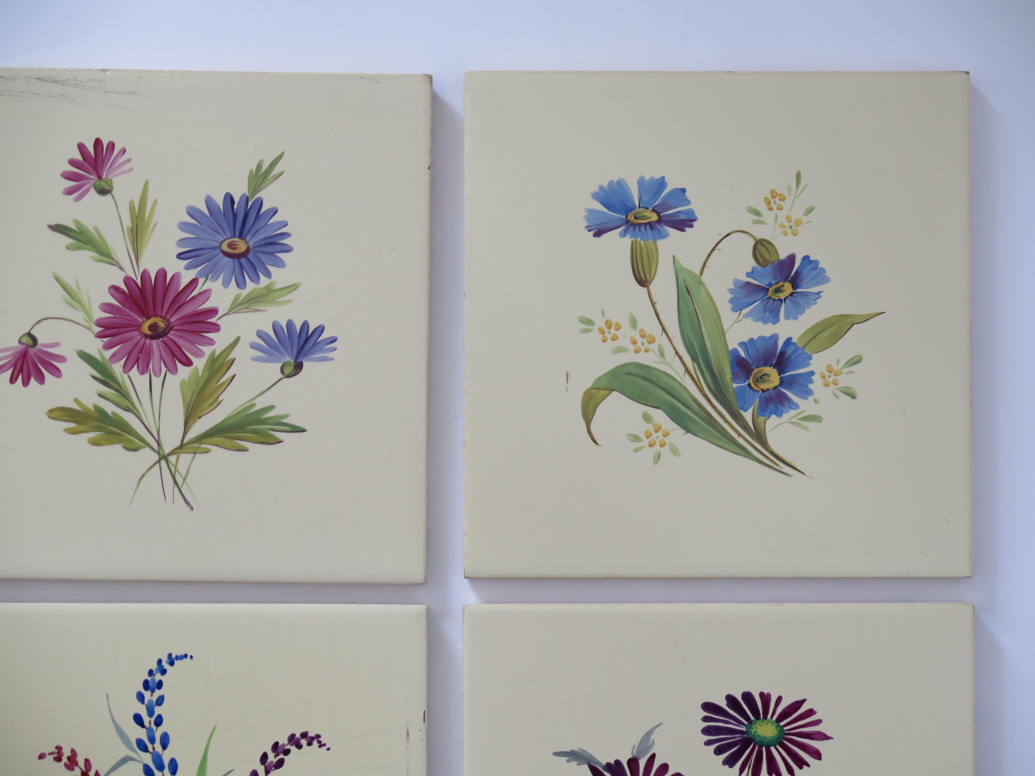 20th Century Set of SIX Ceramic Wall Tiles 6 inches Square hand painted flowers,  circa 1920 For Sale