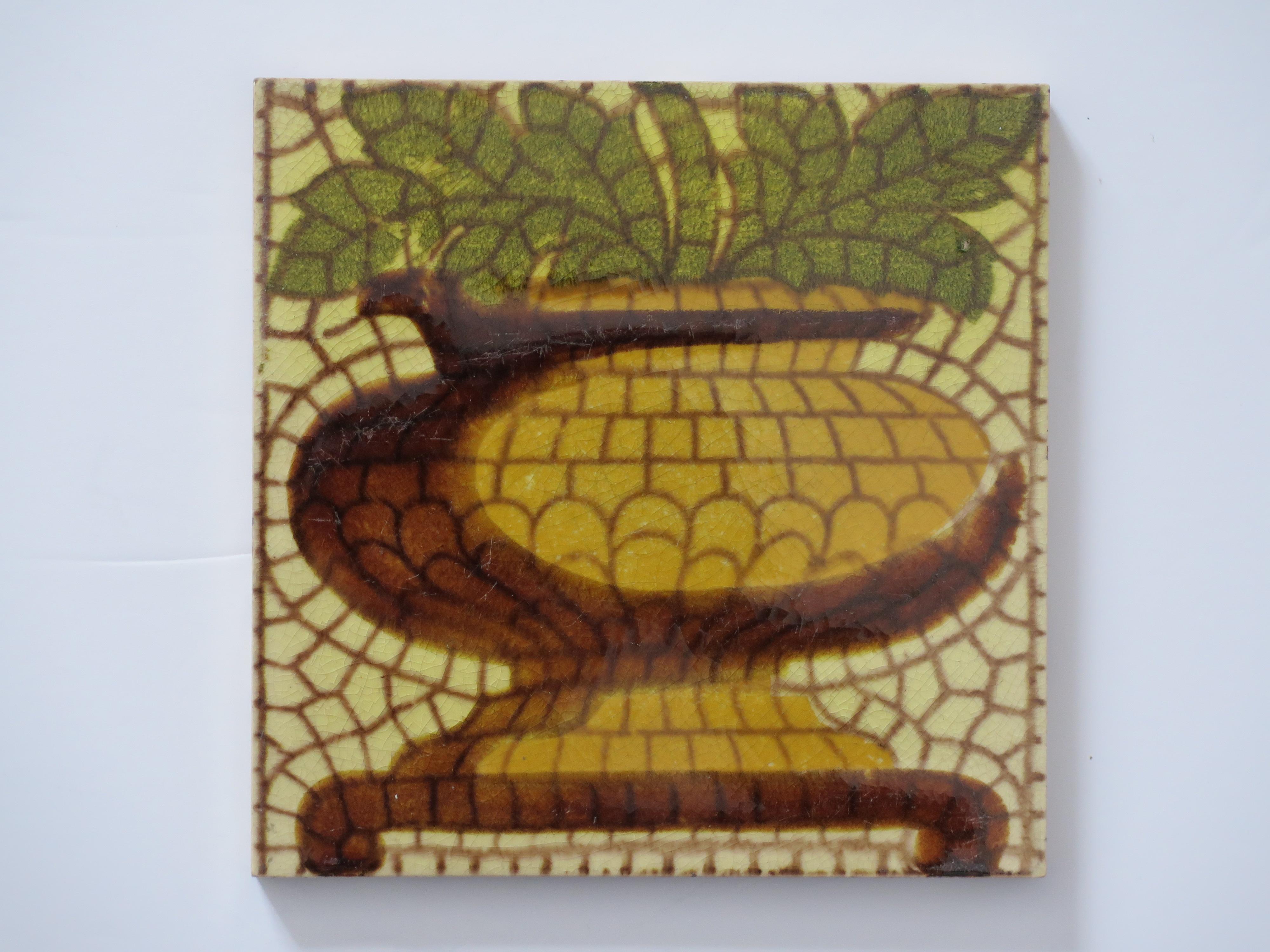 These are a good set of SIX glazed ceramic vintage wall tiles, decorated in a pineapple vase pattern and dating to the mid-20th century, circa 1960. 

Each tile is nominally 6 inches ( 15.3cm) square. The tiles have a pineapple vase pattern with