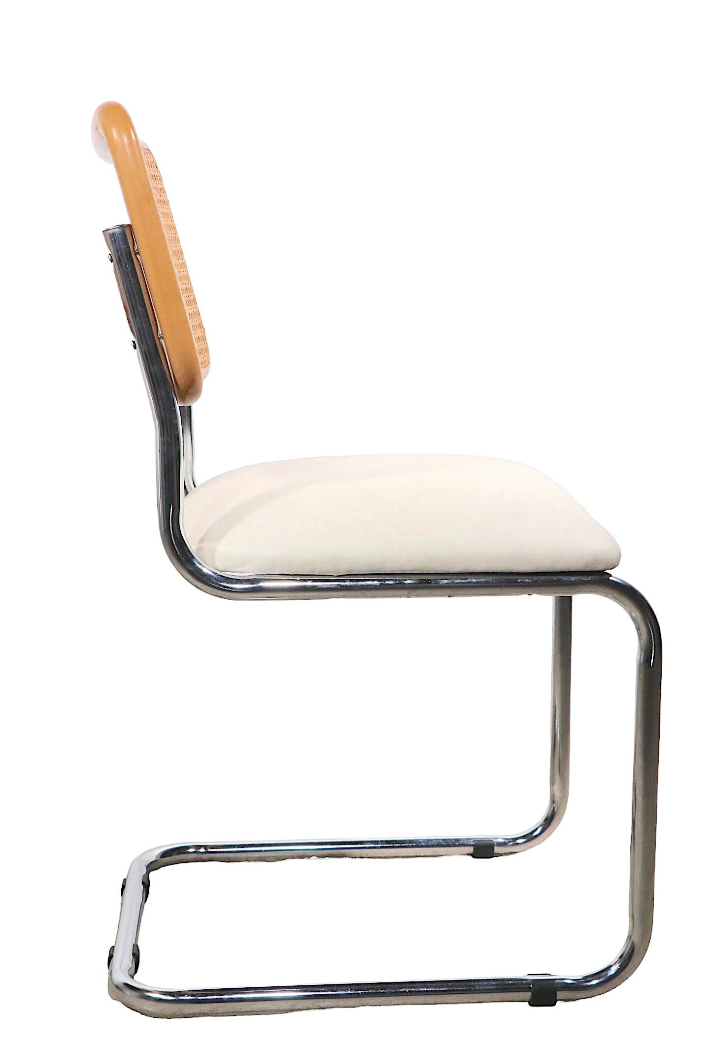 Nice clean set of six Cesca chairs, originally designed by Marcel Breuer, these chair were produced in Italy in the 1970's. The chairs feature caned backrests and newly upholstered white vinyl pad seats, on bright tubular chrome cantilevered frames,