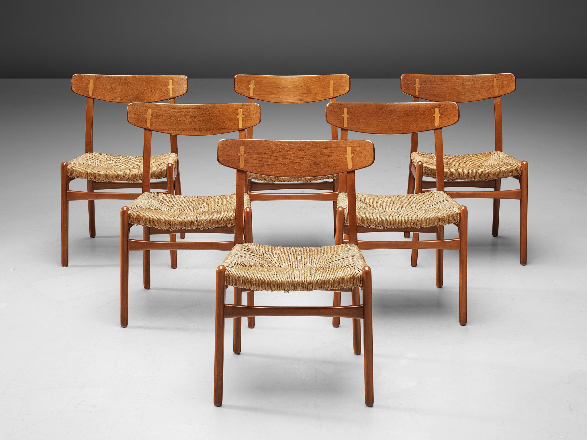 Hans J. Wegner for Carl Hansen, set of 6 CH23 chairs, beech and teak, cane, Denmark, design 1950.

This Scandinavian Modern dining-room set of six chairs is designed by Hans J. Wegner. The model was launched at the same time as the Wishbone chair.