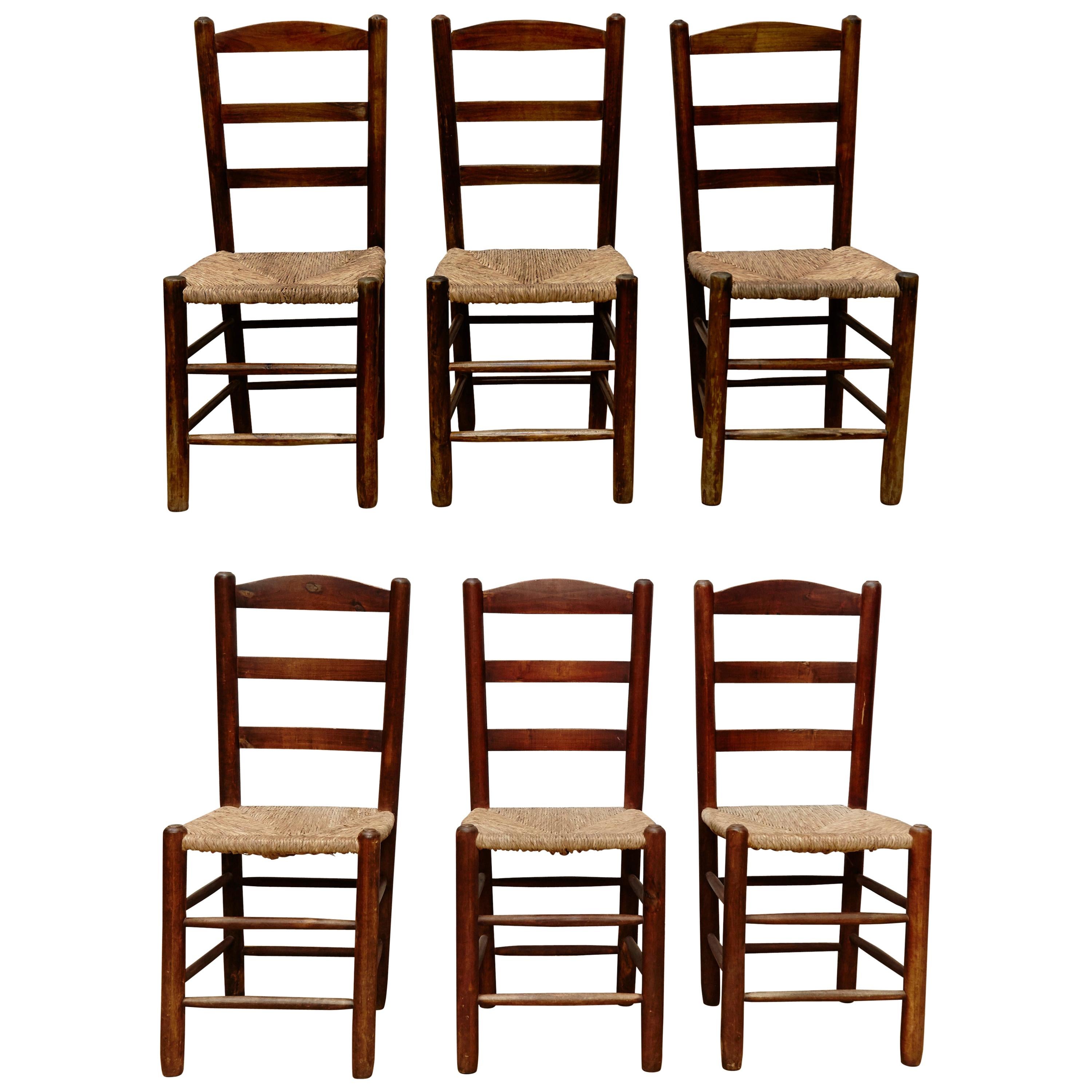 Set of Six Chairs after Charlotte Perriand in Wood and Rattan, circa 1950