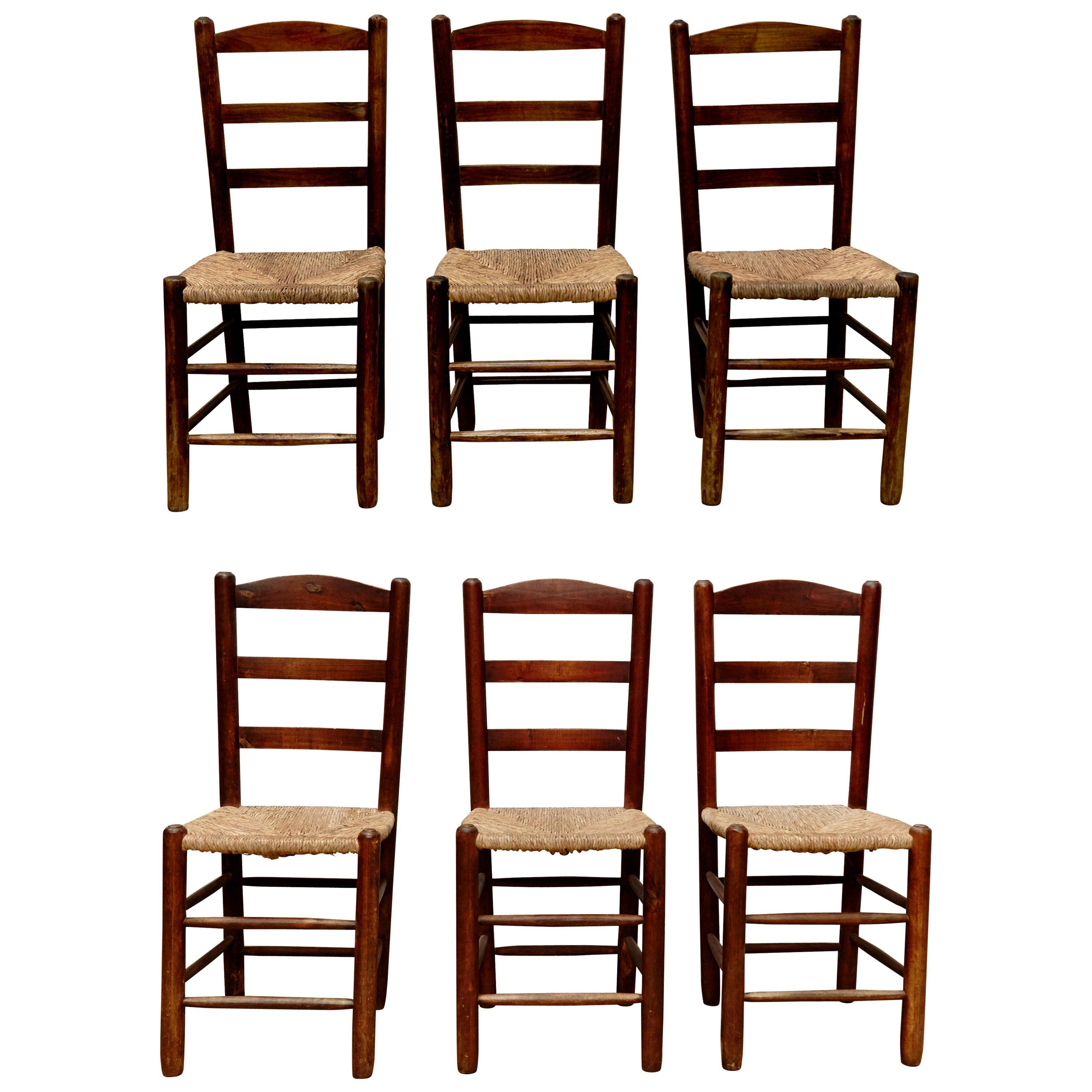 Set of Six Chairs in the style of Charlotte Perriand, Wood & Rattan, circa 1950