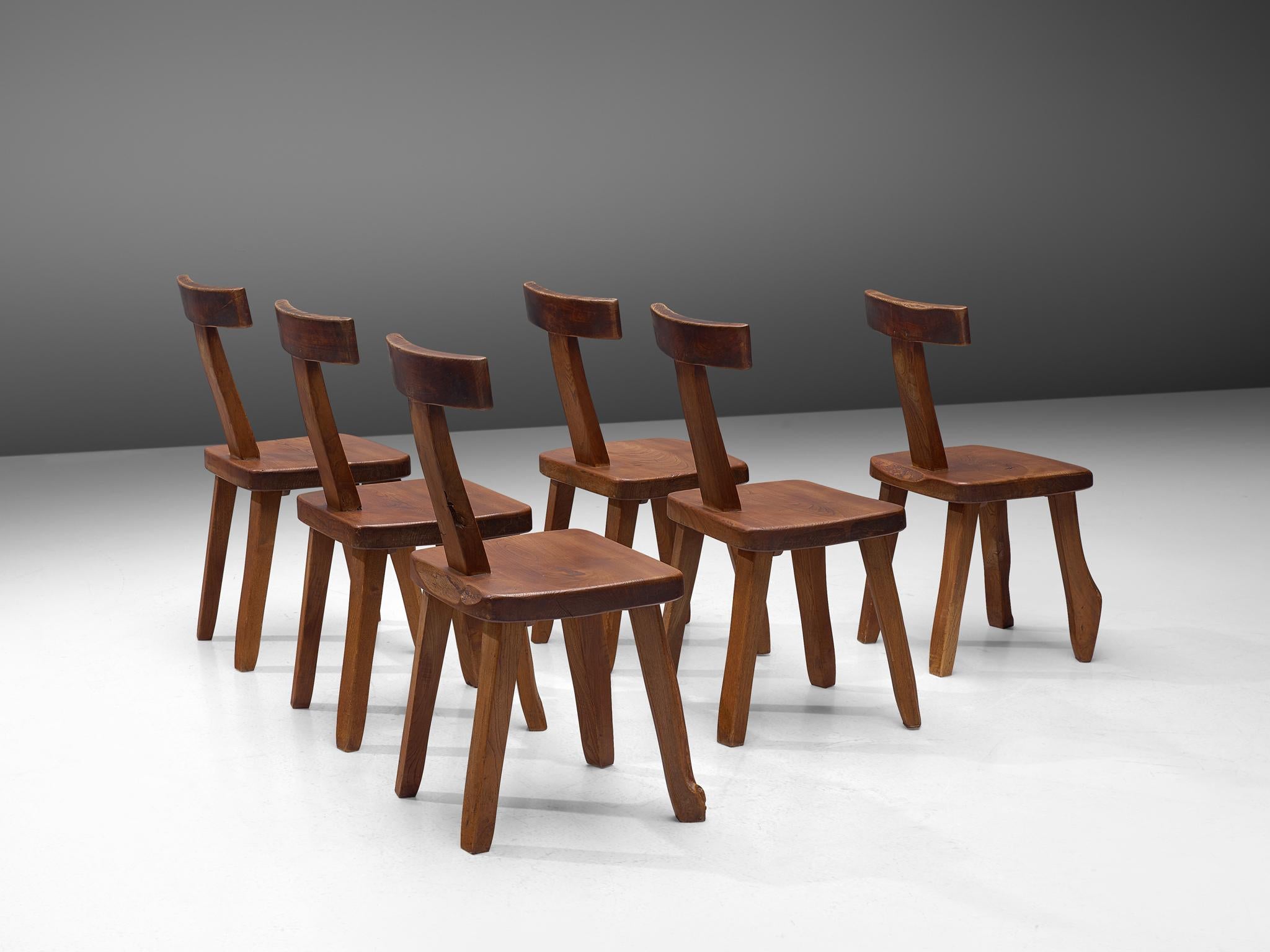 Olavi Hänninen for Mikko Nupponen, set of 6 dining chairs, stained elmwood, Finland, 1950.

Robust sculptural side chairs designed by Olavi Hanninen and manufactured by Mikko Nupponen. These chairs are made of stained elm wood and sculpturally