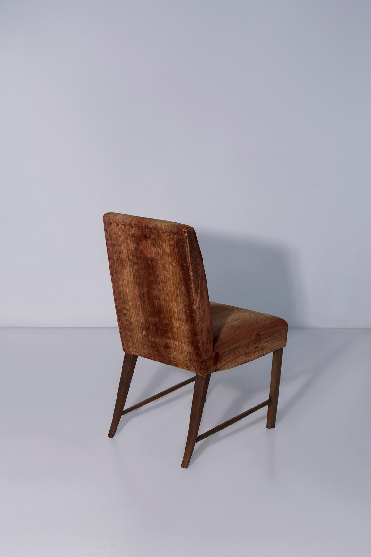 Immerse yourself in the refined atmosphere of 1950s Italian design with this splendid set of six original chairs signed by Paolo Buffa, one of the most distinguished protagonists of high-class furniture of the 20th century. Each chair represents a