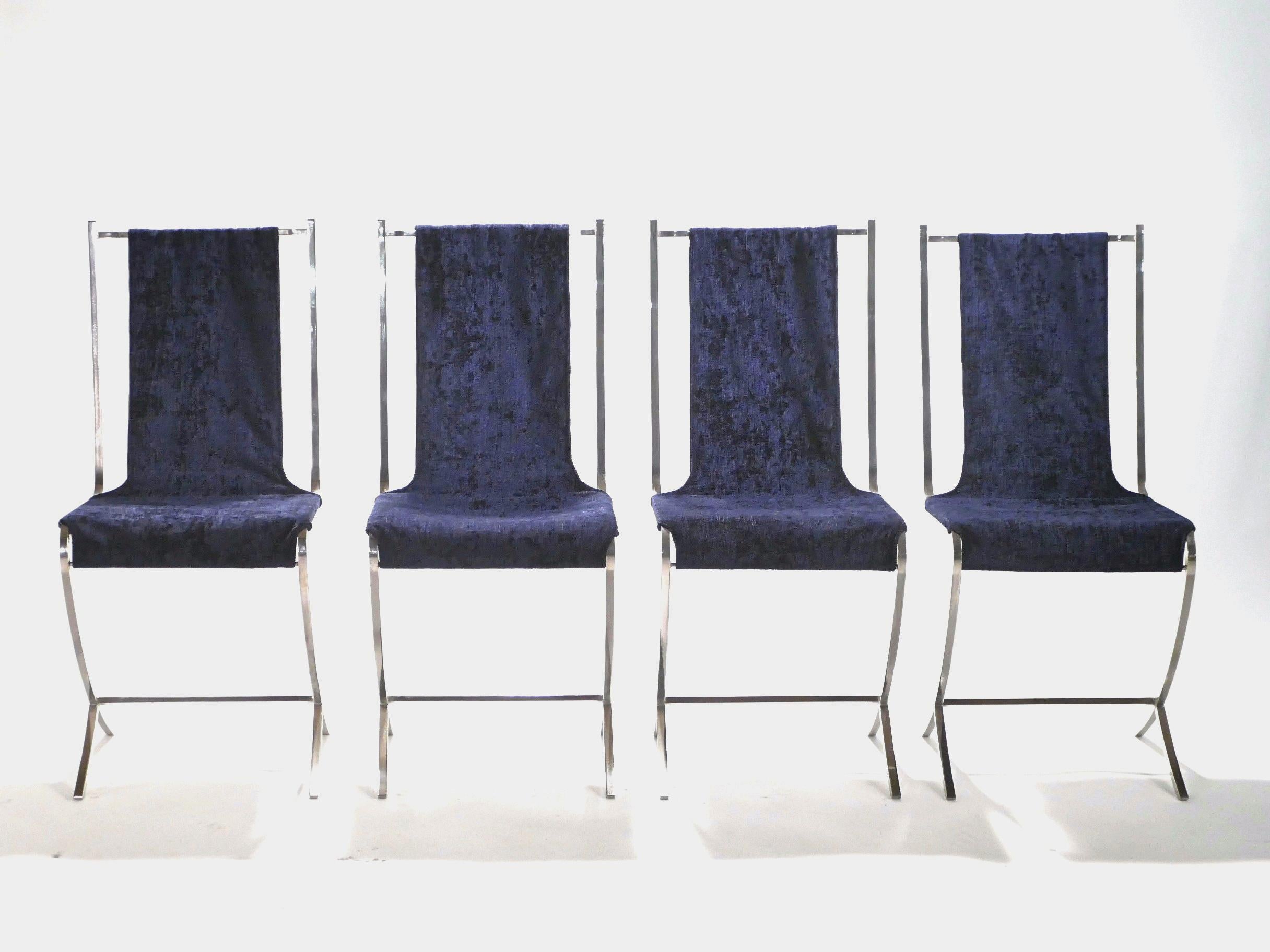 Lounge on extravagant deep blue velvet, suspended across a sturdy, but artfully imagined structure made of heavy nickeled metal. This set of six chairs was created by French Avant Garde designer Pierre Cardin for well-known interior design firm