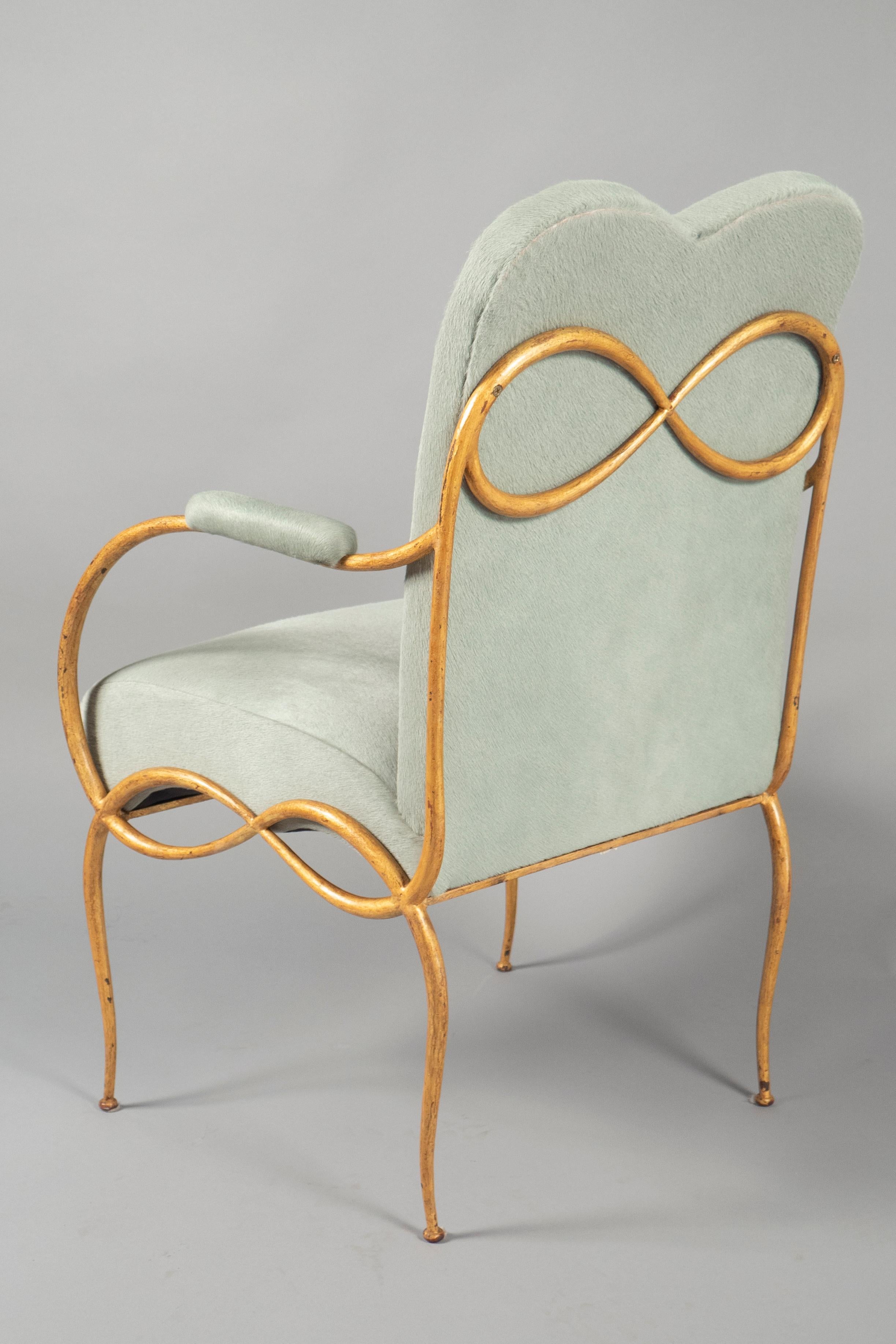Gilded bronze tendril frame with a double-arched back and upholstered armrests. Literature: A Bony’s Furniture and Interiors of the 1940s, Fammarion, 2003, page 78, model illustrated.
 
