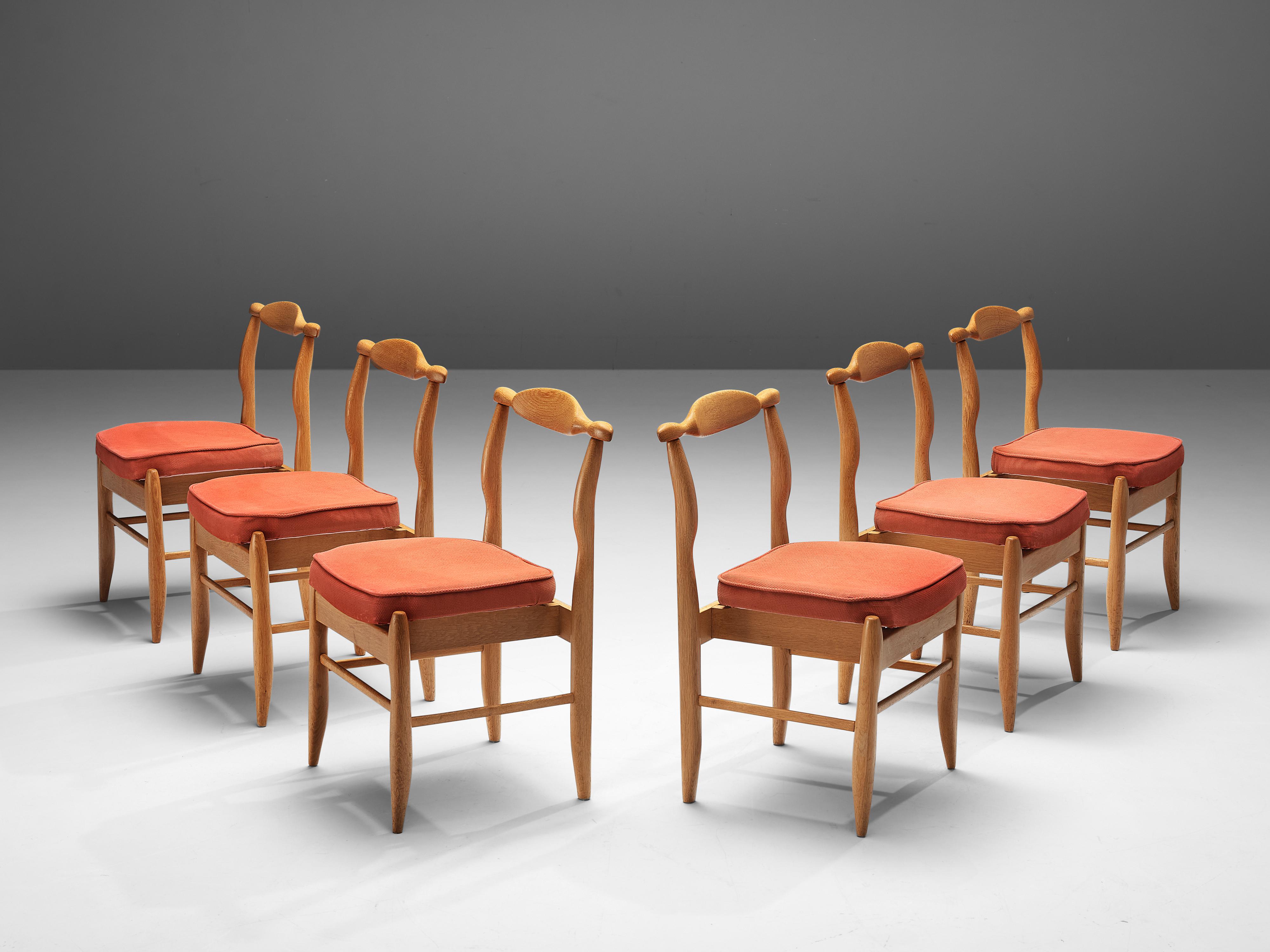 Guillerme et Chambron for Votre Maison, set of six dining chairs, model 'Fumay', oak, fabric, France, 1960s

Beautifully shaped chairs in oak by French designer duo Jacques Chambron and Robert Guillerme. These dining chairs show beautiful lines in