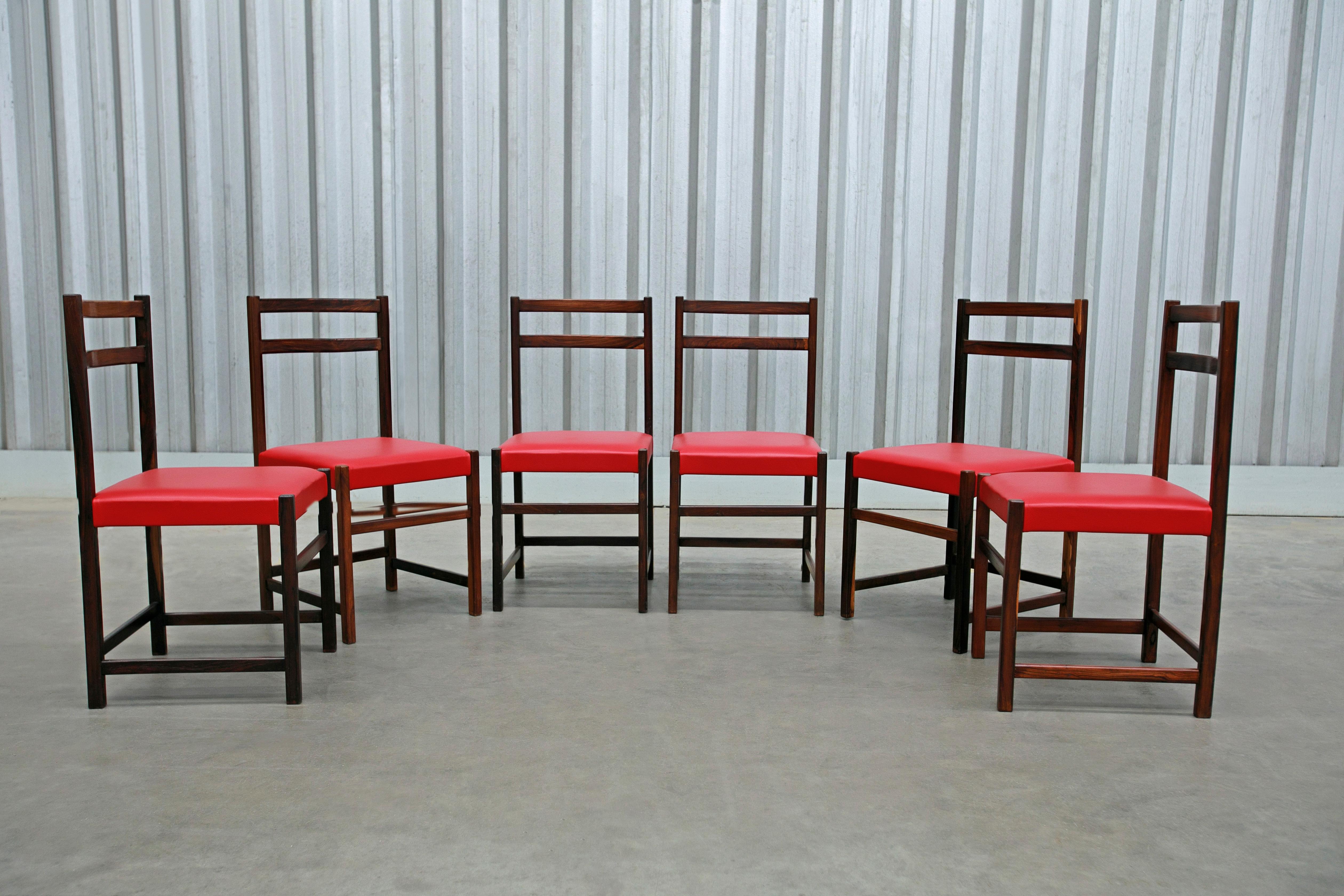Available TODAY in NYC including FREE DOMESTIC SHIPPING, these Set of Six Chairs in Rosewood & Red Leather by Celina Decoracoes, 1960s are nothing less than gorgeous!

The wood has been refurbished and is in excellent condition. The red leather is
