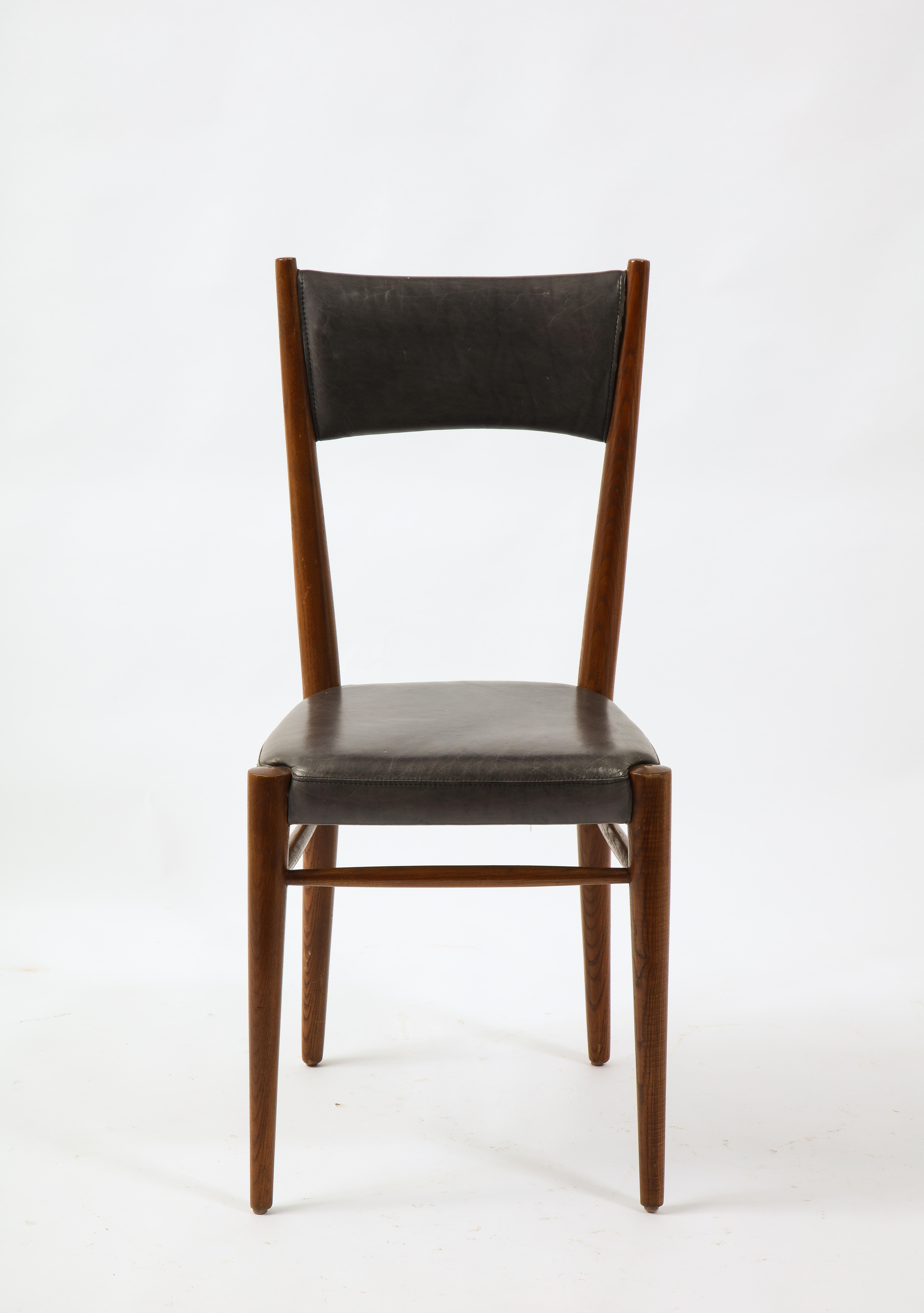 Set of six side chairs by Genevieve Pons, Leather over oak. These chairs are very upright.