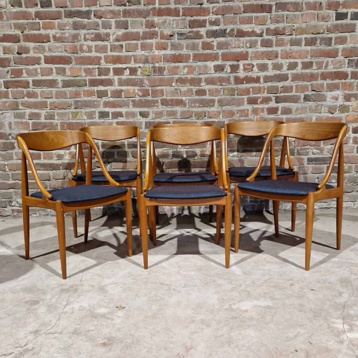 Set of six dining room chairs made by famous danish designer Johannès Andersen. The chairs were made in Denmark, in the also famous Uldum Mobelfabrik. The original factory sticker can be found on the chairs. The overall look of the chair is elegant