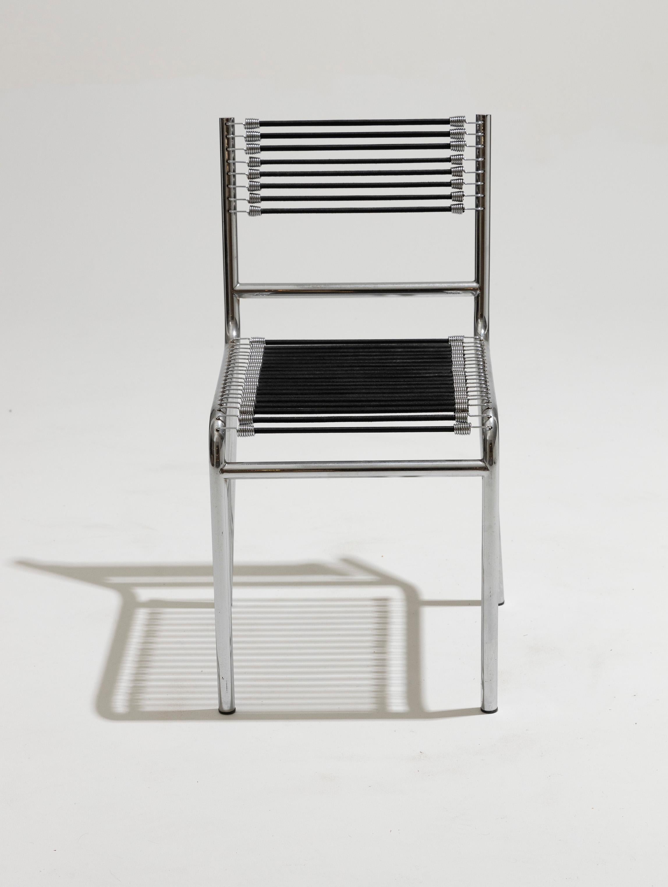 20th Century Set of six chairs in steel and elastic cord, René Herbst, 1970s