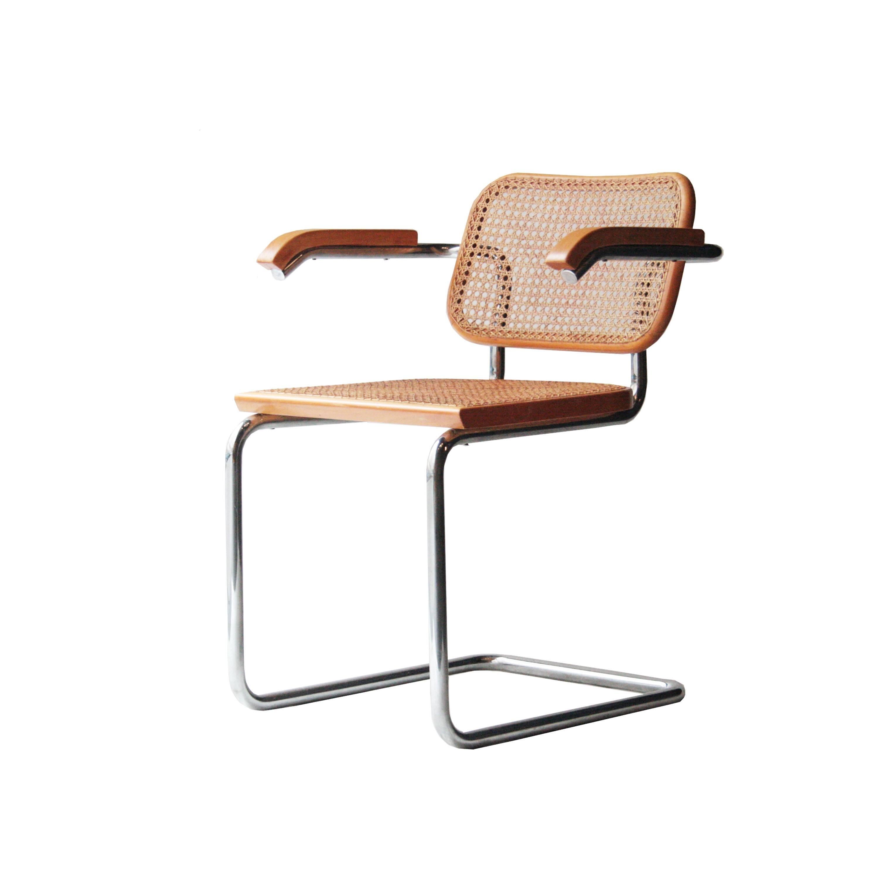 Set of six chairs model B64, Cesca, designed by Marcel Breuer. Structure made of chromed tubular steel, seat and back made of wood and natural fibre. German design originally from 1927, and produced by Gavina (Italy) since 1962.
     