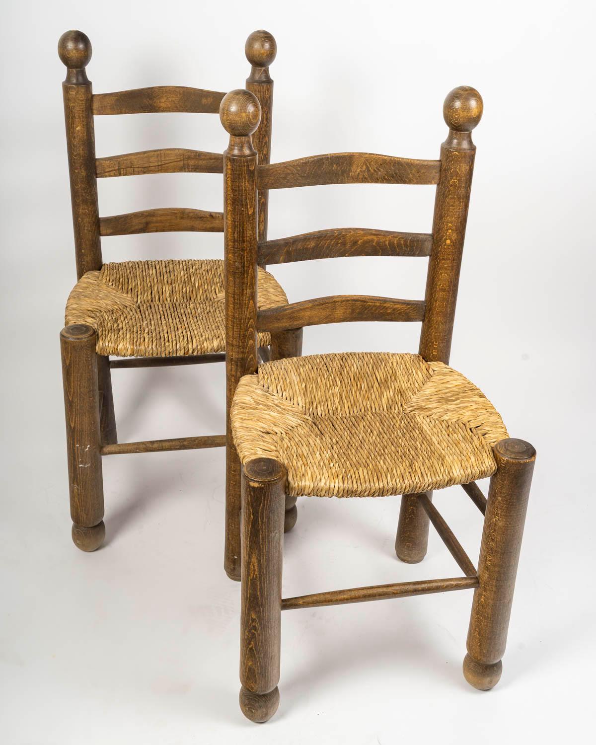 French Set of Six Charles Dudouyt Dining Chairs in Wood and Cane, 20th Century. For Sale