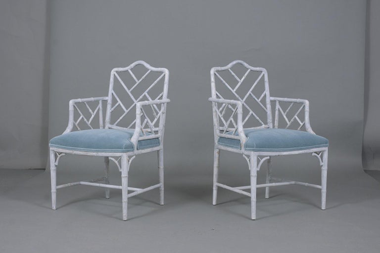 An extraordinary set of six Chippendale-style dining room chairs crafted out of wood fully restored by our professional team of craftsmen. This vintage set features two armchairs and four side chairs newly painted in a grey and oyster color