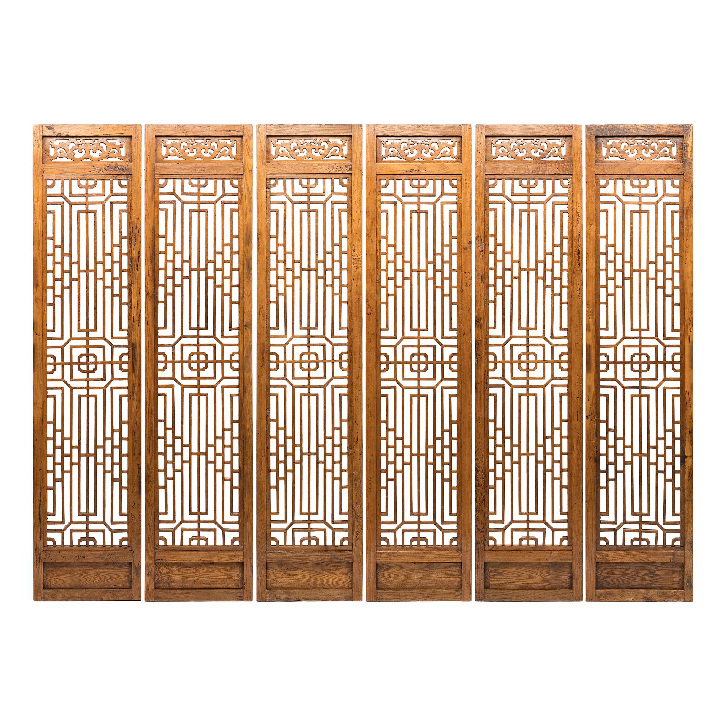 A hallmark of Qing-dynasty domestic architecture, tall lattice panels such as these were used in traditional courtyard homes to allow light and air into a room whilst maintaining privacy. With grand proportions and elongated windows, this set of six