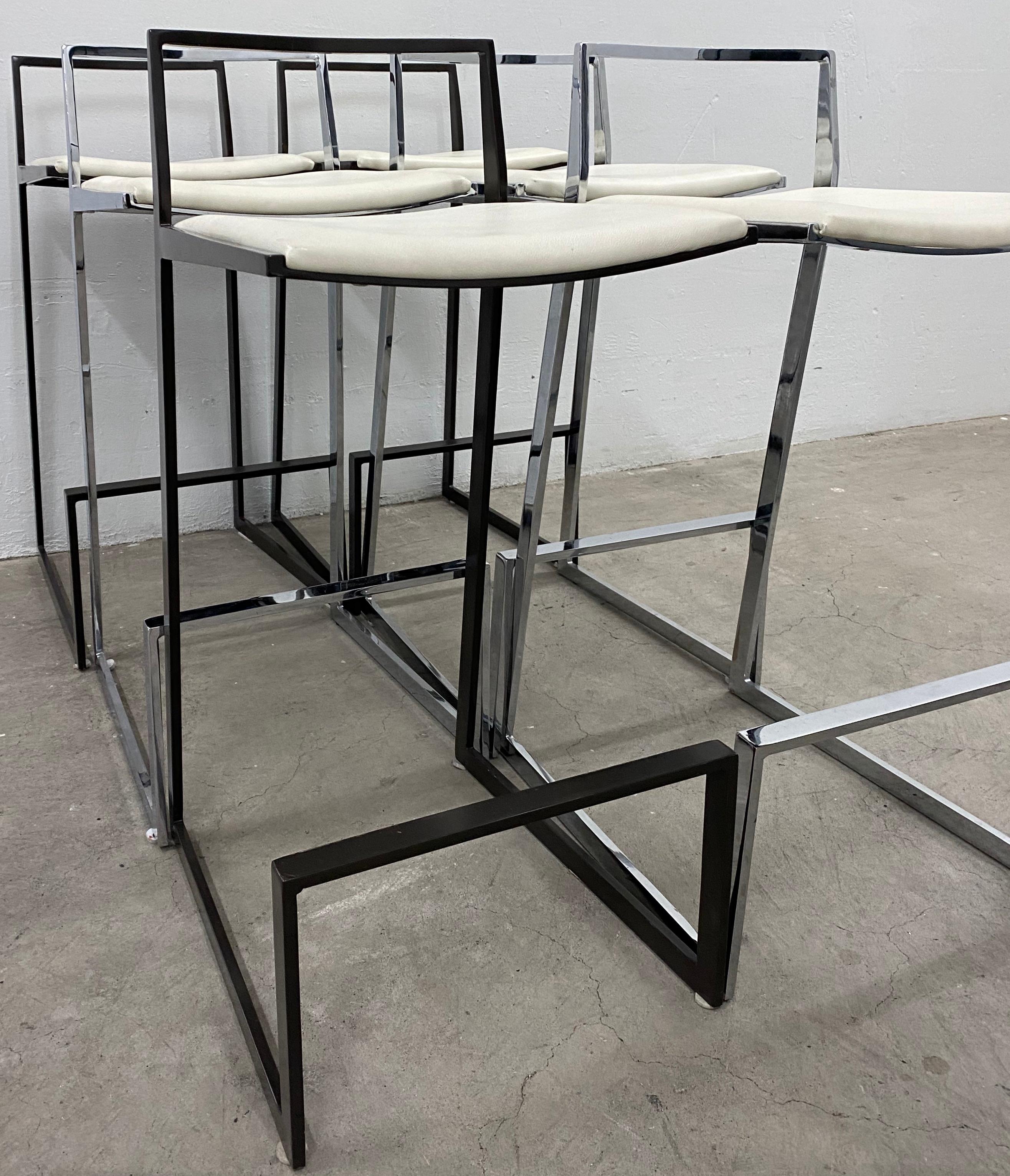 Set of six Espresso, chrome and white leather modern bar stools

Style of Milo Baughman

Beautiful modern bar stools made from chrome. Three painted with a rich espresso color and upholstered with white leather, the other three are a chrome