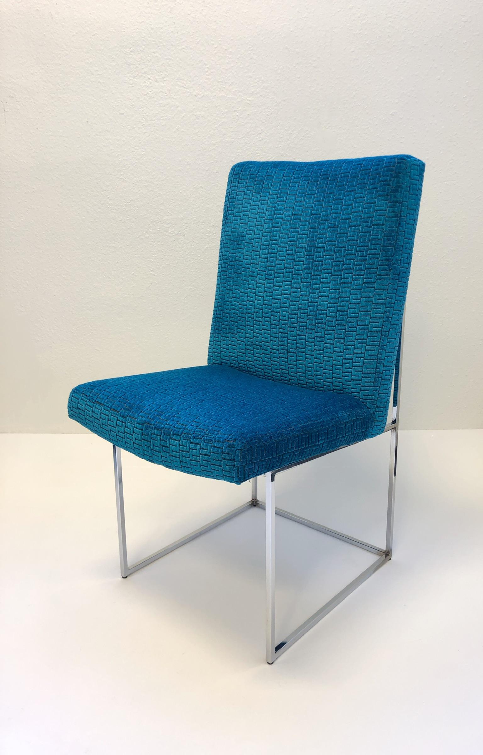 A glamorous set of six polish chrome”Thin Line” dining chairs Desin by Milo Baughman for Thayer Coggin in the 1970s. The chairs have been newly recovered in a soft dark turquoise burn out velvet with a S pattern design (see detail photos). We have a