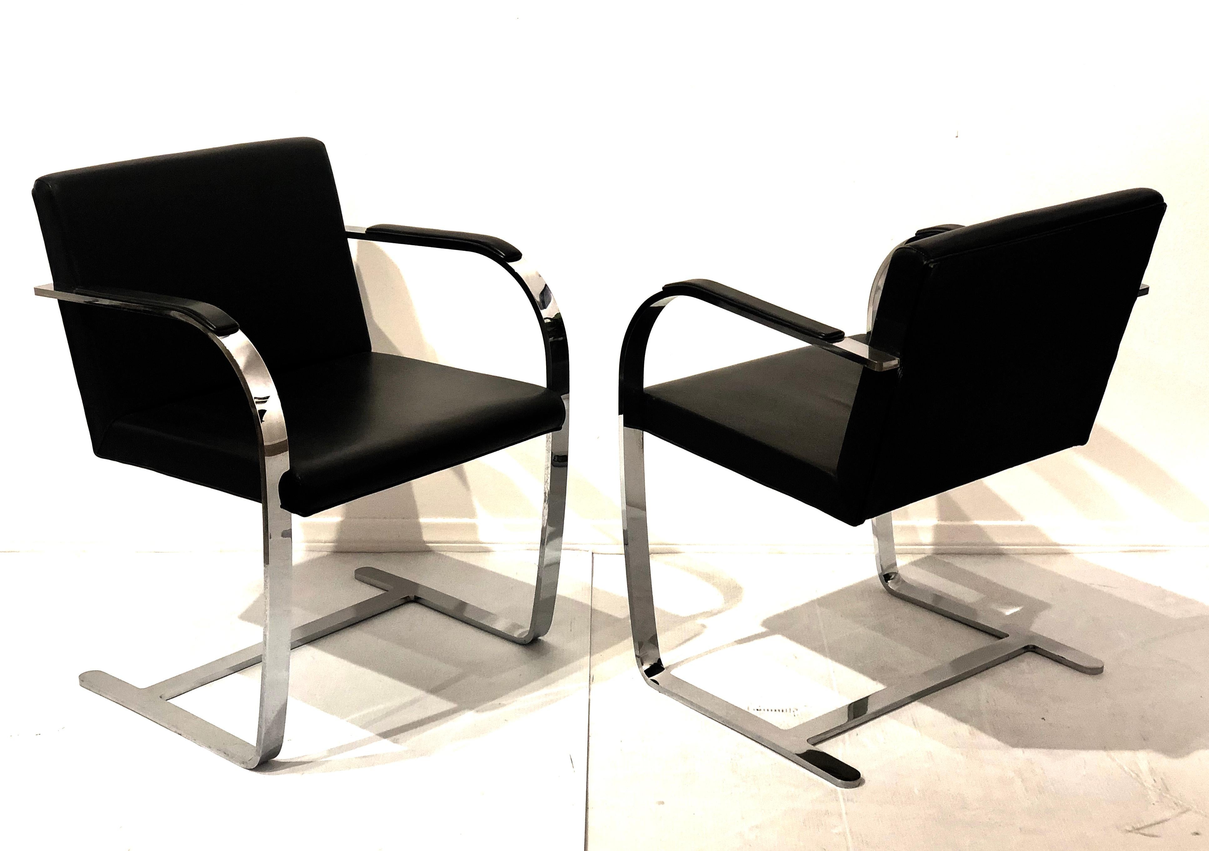 Nice set of six gently used Brno style chairs in flat arm side chair stainless steel polished to a mirror-like finish, and black leather seat with soft armrest in leather, solid and sturdy with a little rocking movement.