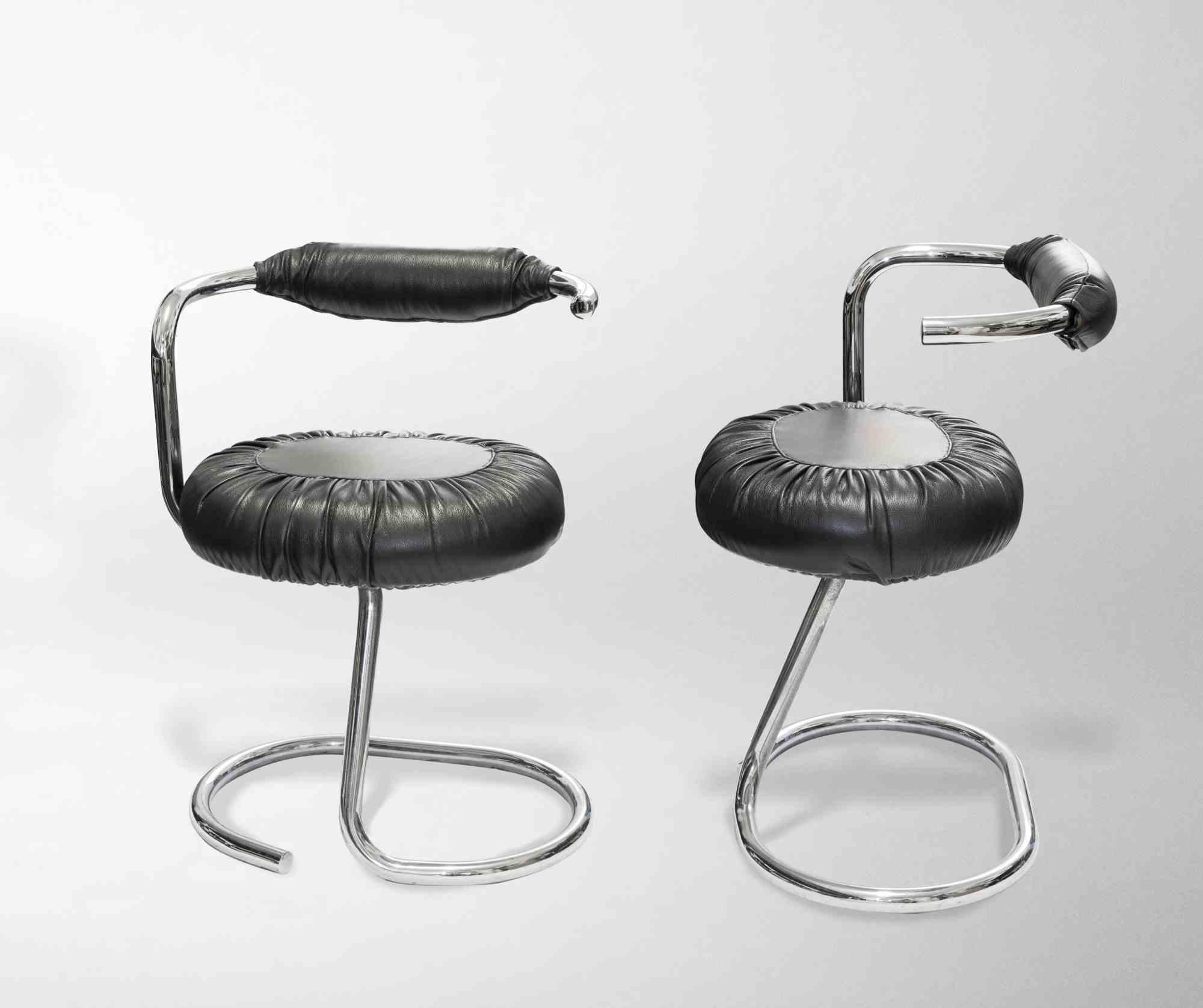 Black Cobra chairs is an original set of chairs realized in the 1970s by Giotto Stoppino (Milan, 1926).

Chromed tubular steel structure and black leather

This 'Cobra' chair was designed by Giotto Stoppino during the 1970s and produced in