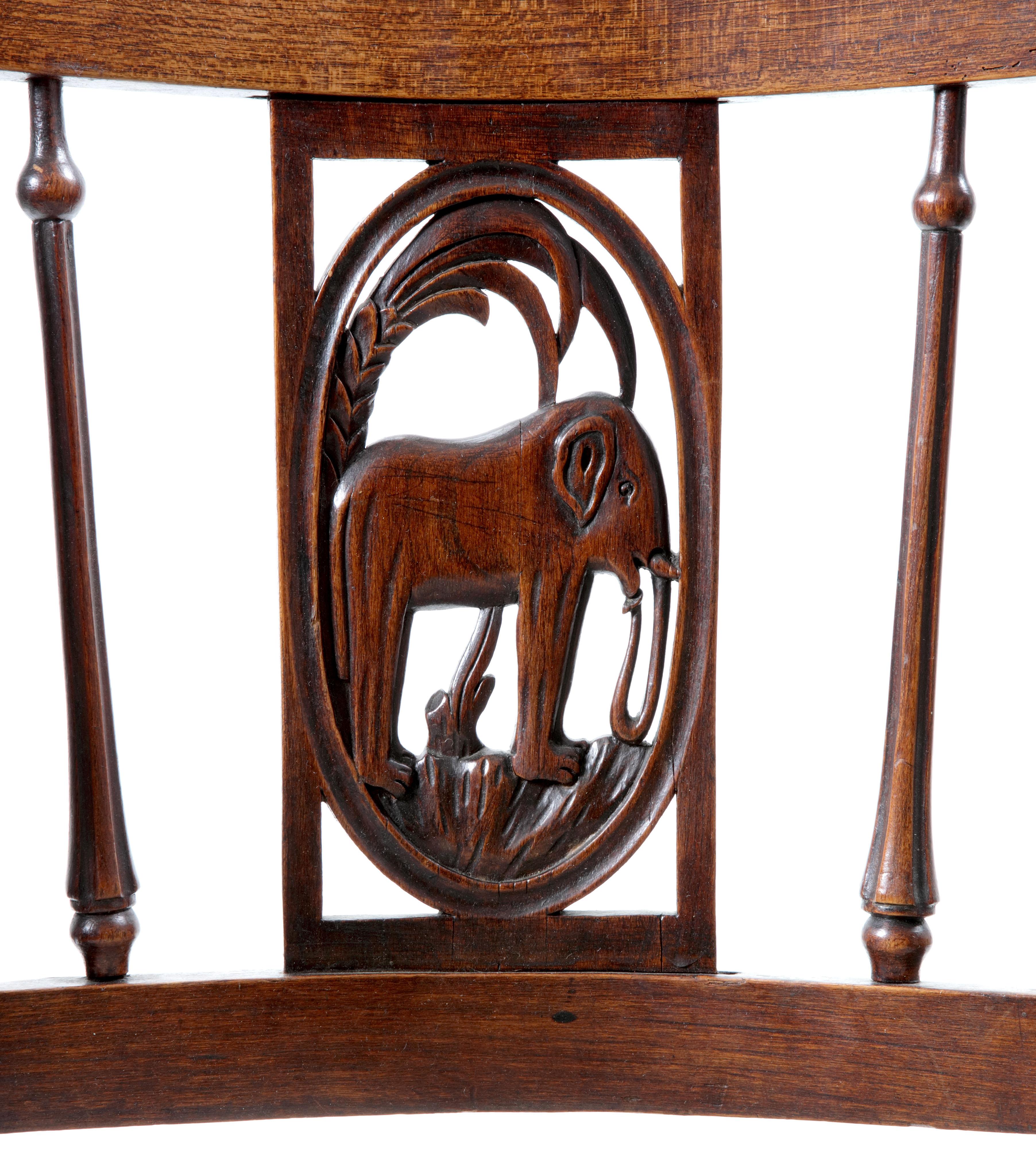 A set of six French Directoire chairs with figural back splats depicting African animals

France, early 19th century


Each in elm and pear wood, with later upholstery, each with a back splat depicting an African animal; elephant, camel,