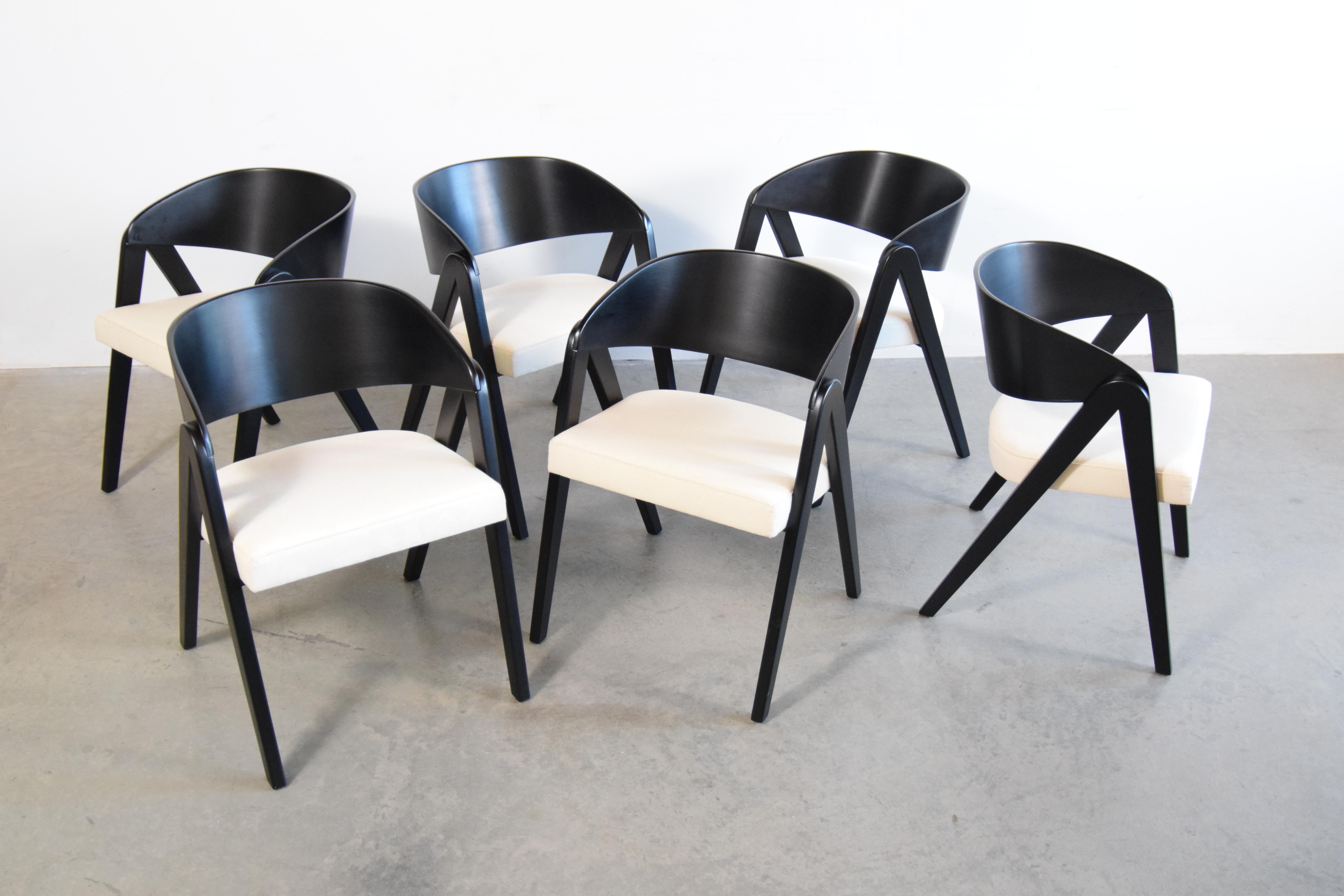 Set of six Compass chairs in black lacquer, designed by Allan Gould, circa 1941 and produced by Herman Miller. Also known as model #4171, this design was considered one of Gould's best. Newly upholstered in 100% organic cotton linen canvas.

