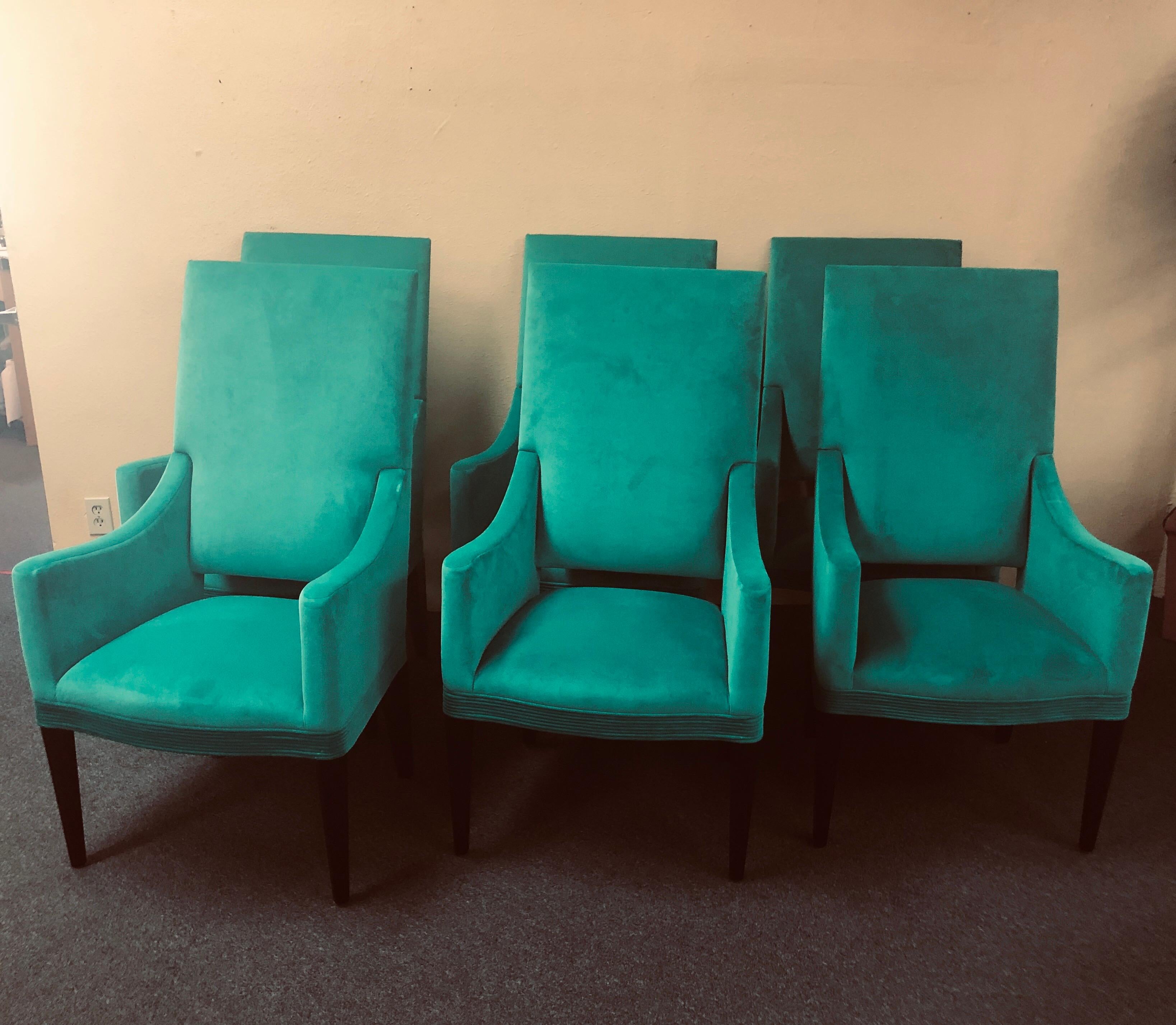 Elegant set of six contemporary high back chairs by Donghia furniture, circa 2000s. The chairs are a kelly green in color with a low profile crushed velvet upholstery. All the chairs have side arms, a high back and matte black octagonal legs and are
