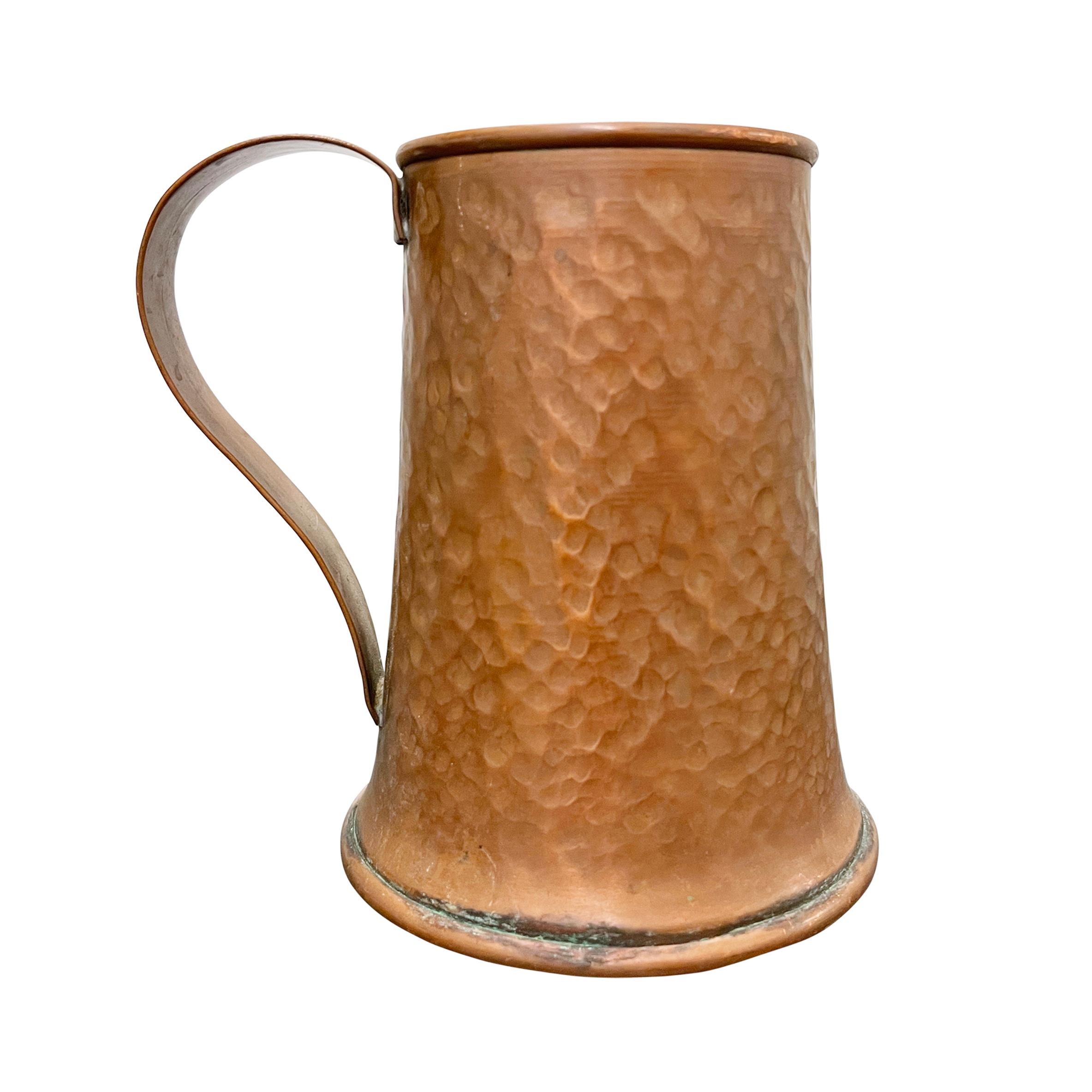 A wonderful set of six hand-hammered copper beer tankards waiting for your next cocktail concoction, or perfect for spreading down the center of your dining table and filling with flowers or candles.