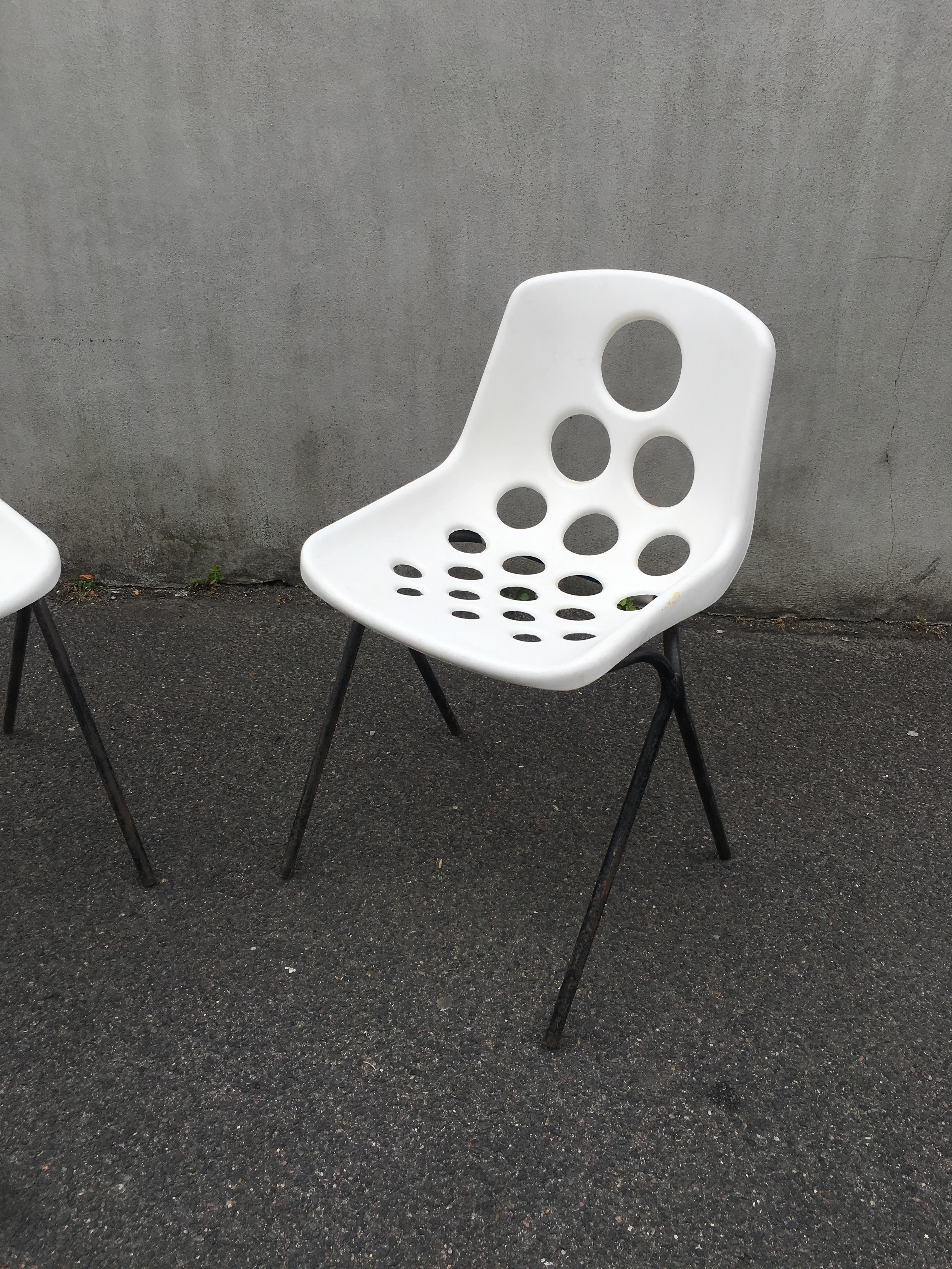 Set of six Coquillage stacking chairs in the style of P. Guariche, circa 1960.