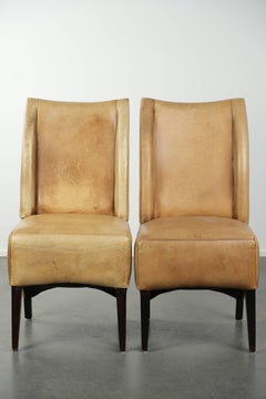 Set of six cowhide dining chairs with a comfortable seat and high back
