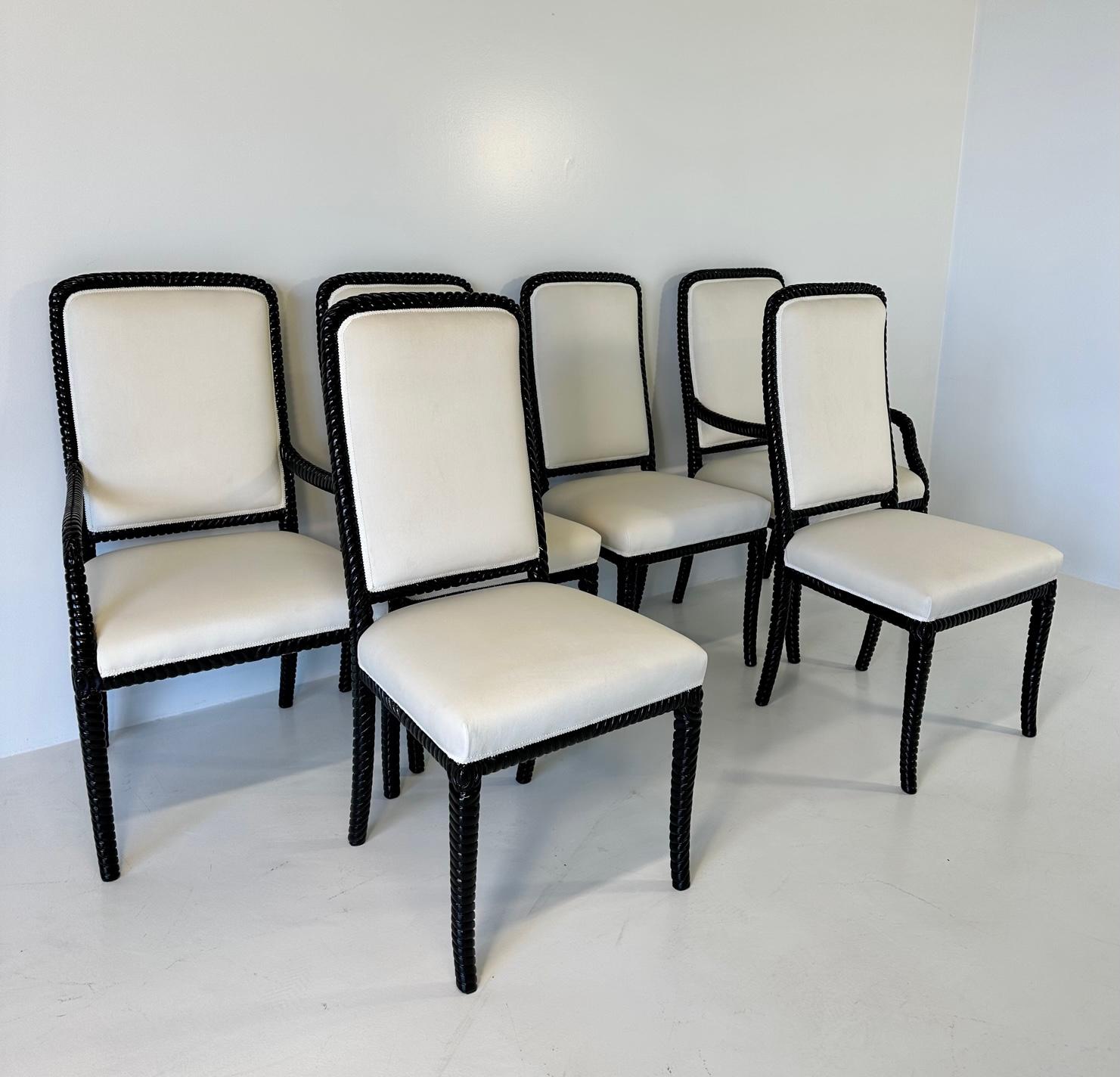 This set of six Art Deco style chairs was produced in Italy. 
The set is composed by 4 chairs and 2 capital chairs with arms. 
All of the six are covered with a fine cream velvet and the structure is in black lacquered wood. 
Chairs: 52 cm x 57cm