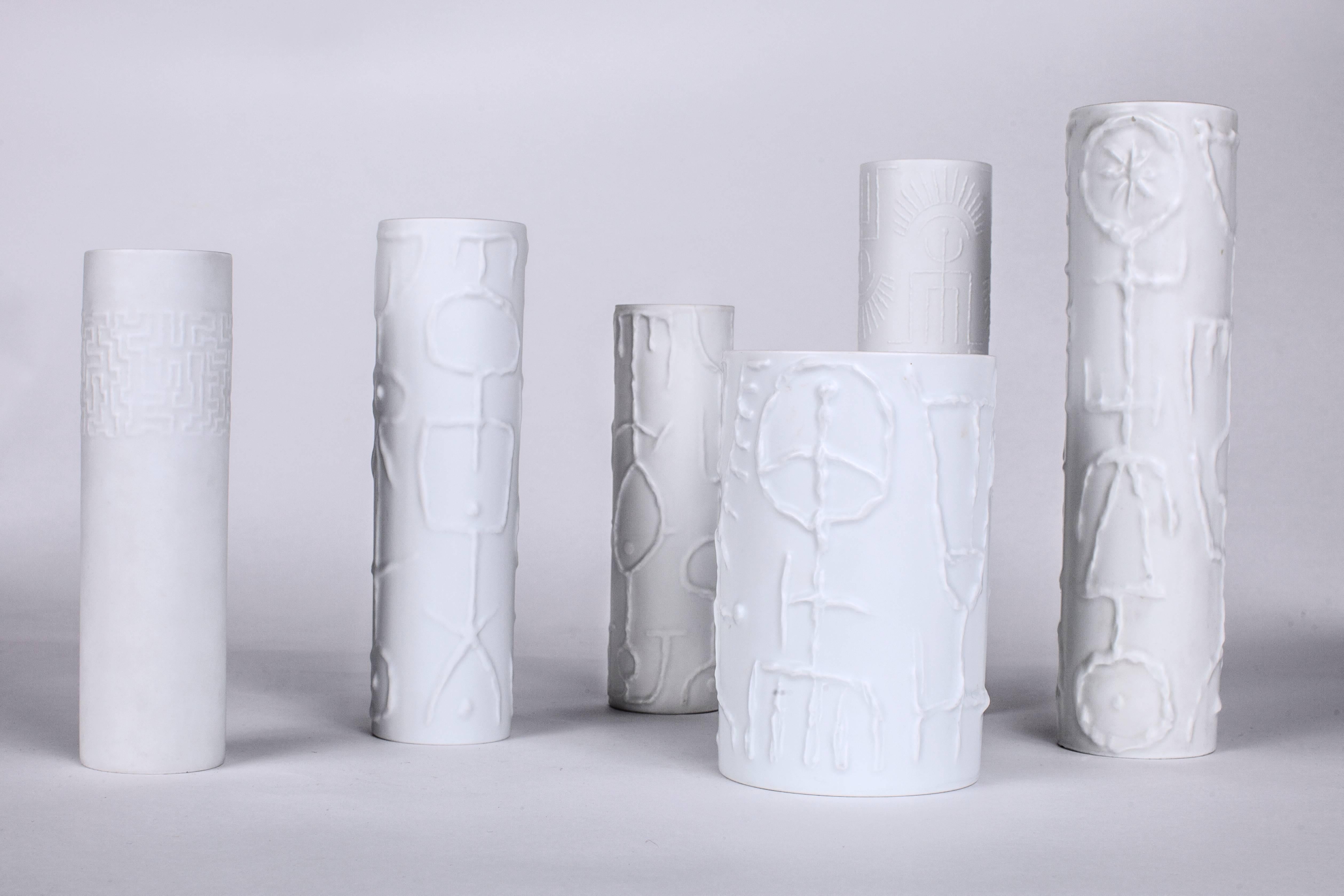 Cuno Fischer (1914–1973)

Set of six graphic, modernist glazed porcelain vases by German painter and designer Cuno fischer for Rosenthal, decorated with delicate raised geometric glyphs.

Various heights and diameters: 2.5’’ to 5’’ Ø x 7.5’’ to
