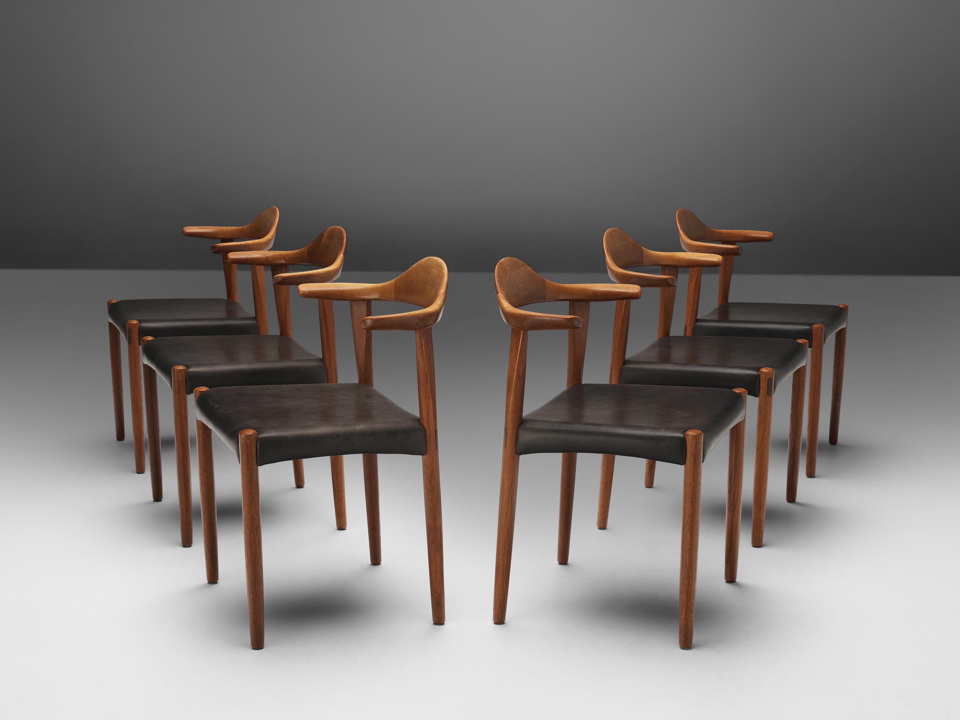 Set of six dining chairs, teak, leather, Denmark, 1960s

What gives this particular model the nickname 'cow horn' is the way the combination of back, and armrest is designed with pointy, tapered ends that remind of a cow's horn. This version of