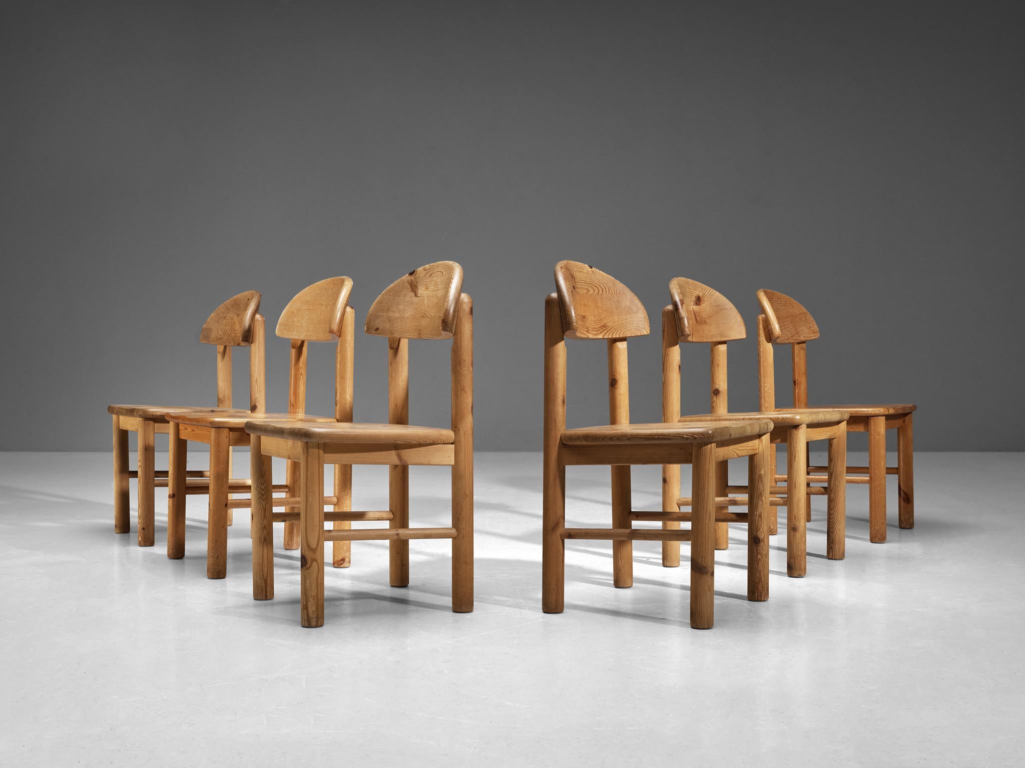 Set of ten dining chairs, pine, Denmark 1970s. 

Beautiful, organic and natural dining chairs in solid pine. A simplistic design with a round seating and attention for the natural expression and grain of the wood. These chairs hold a beautiful