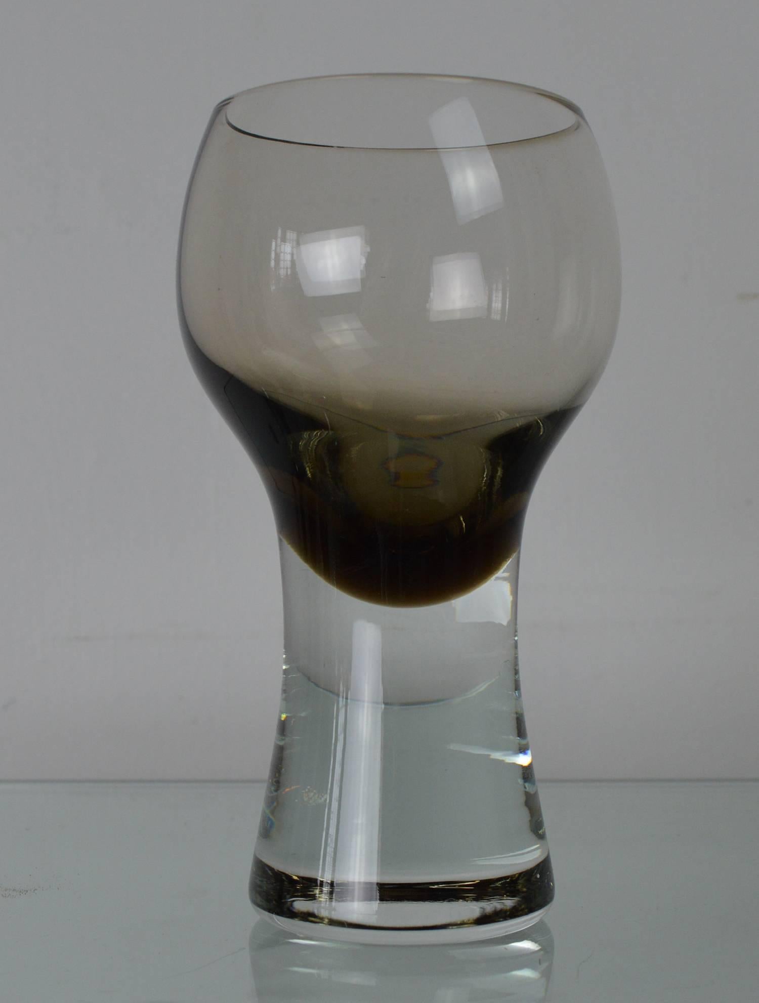 Very chic set of tinted drinking glasses.

Wonderful asymmetrical shape. Highly evocative of the 1970s.

Great color. Seems to change in different lights.

Free shipping.
 