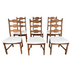 Juego de seis sillas de comedor modernas danesas con asientos de piel de oveja