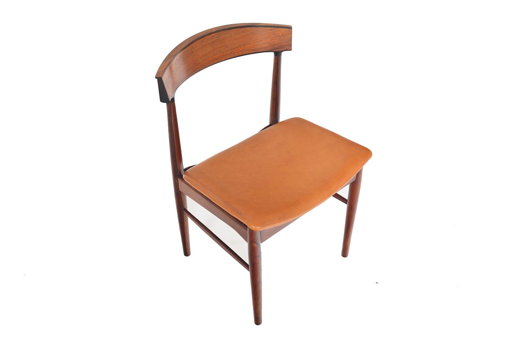 Timelessly classic and elegantly simple, this set of six Model 10 dining chairs were designed by Johannes Andersen for Hans Bech in the 1960s. Beautifully curved backrests are complimented by highly figured Brazilian rosewood frames. Curved,