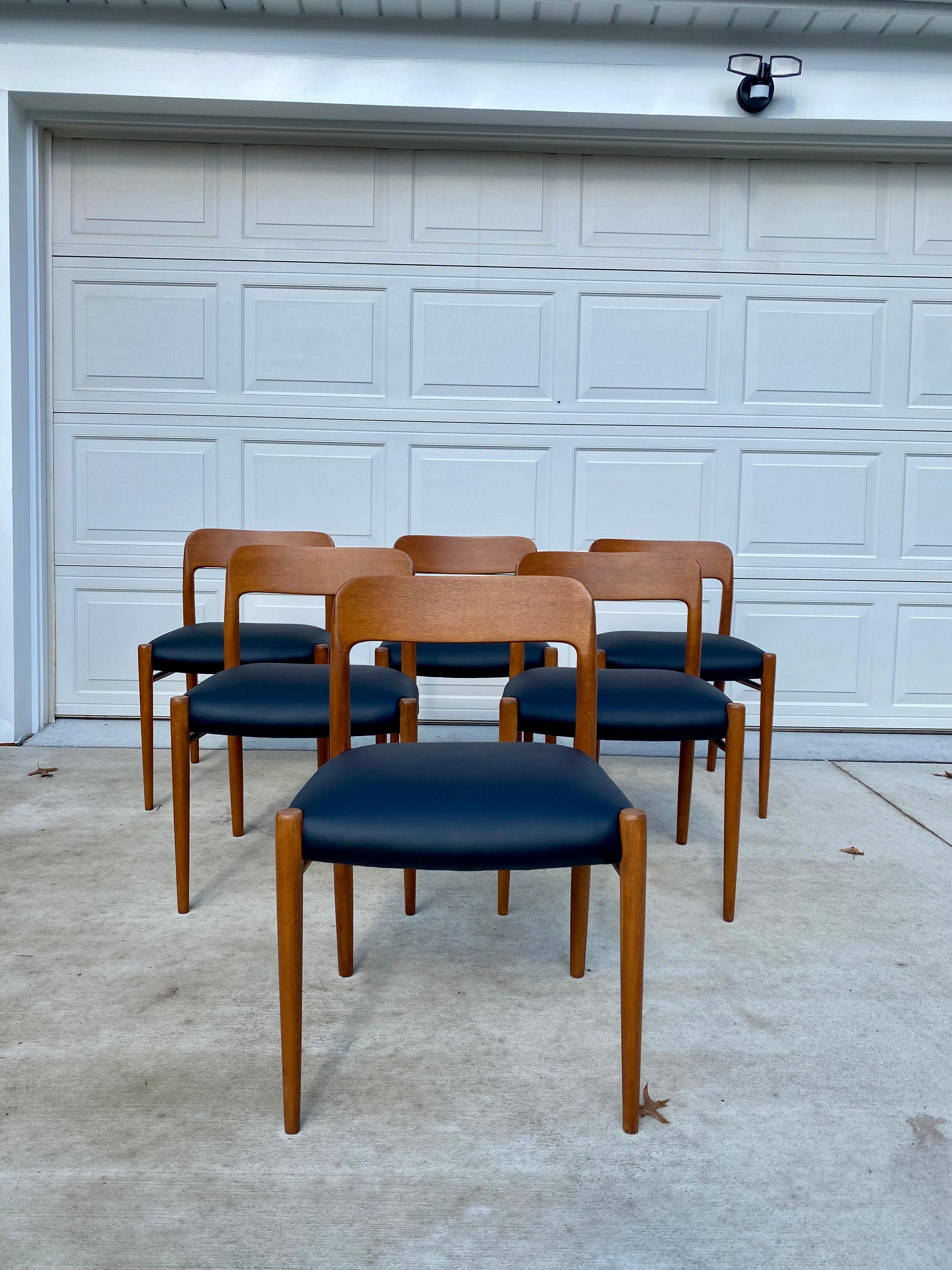 Beautiful set of 6 Niels Moller mod. 75 chairs for J.L. Moller, Denmark. This set has been fully refinished with new lacquer to bring out the teak color. Originally these chairs had rope seating but because of damage, it has been reupholstered in a